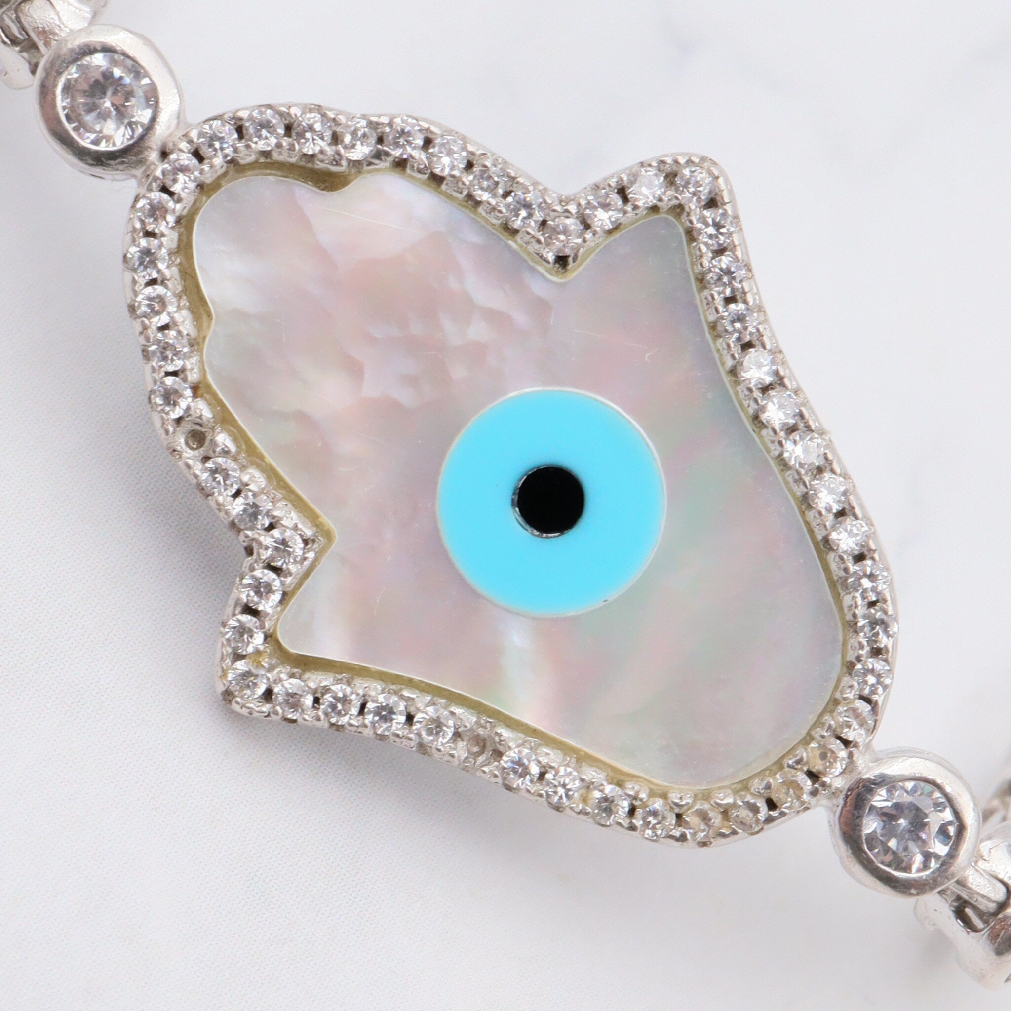 Vintage sterling, mother of pearl, hand of fatima and evil eye bracelet with cubic zirconia links