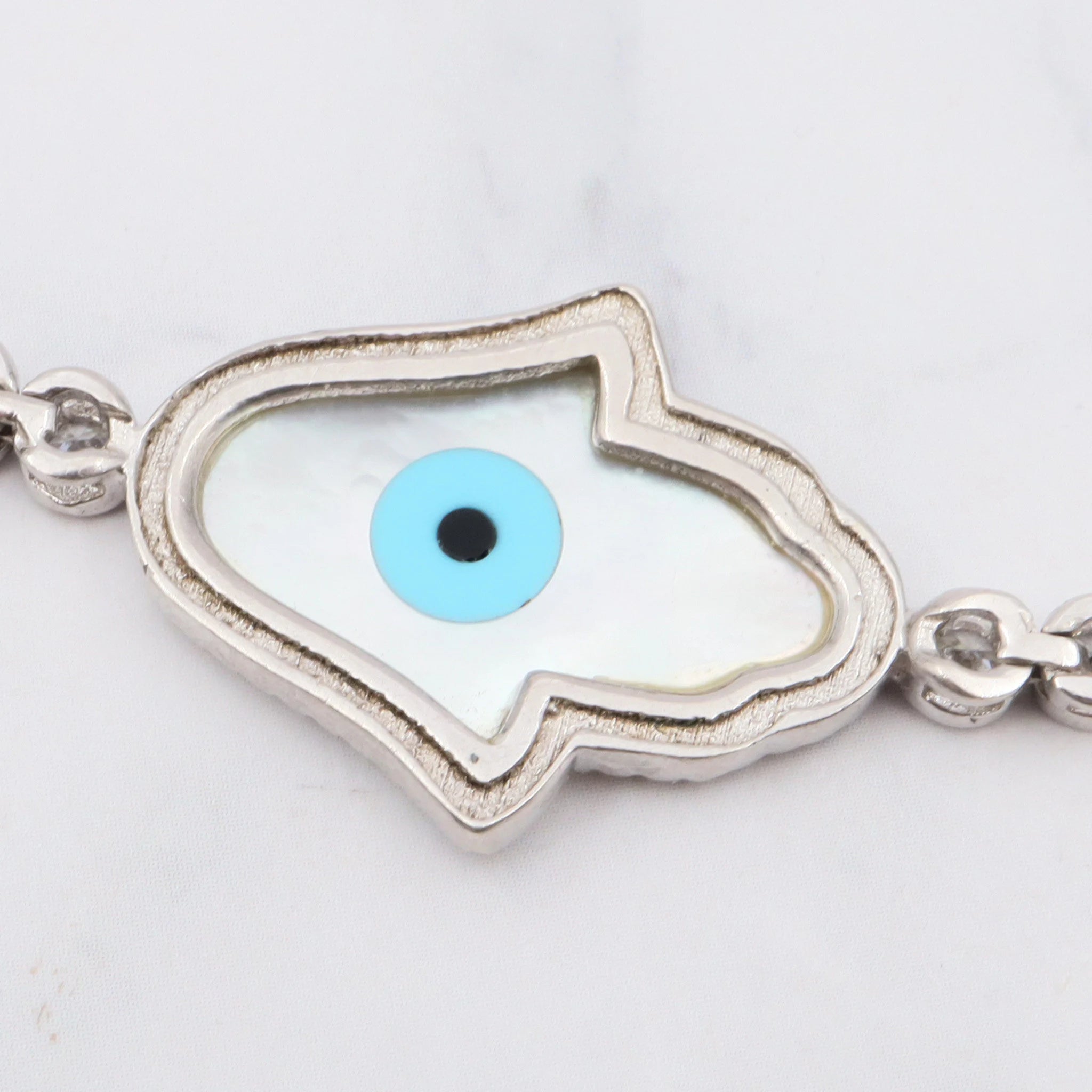 Vintage sterling, mother of pearl, hand of fatima and evil eye bracelet with cubic zirconia links