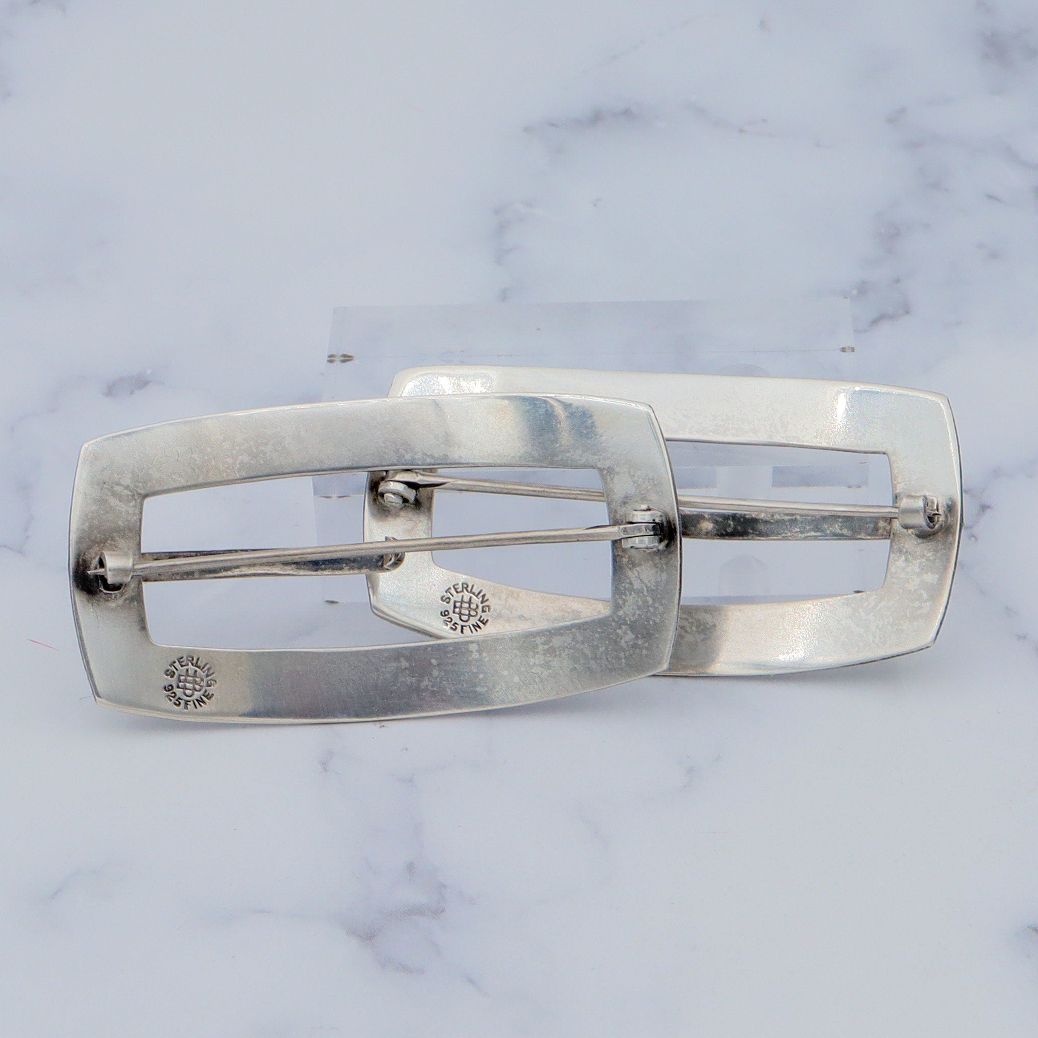 Pair of Antique bright cut engraved sterling Unger Brothers buckle brooches