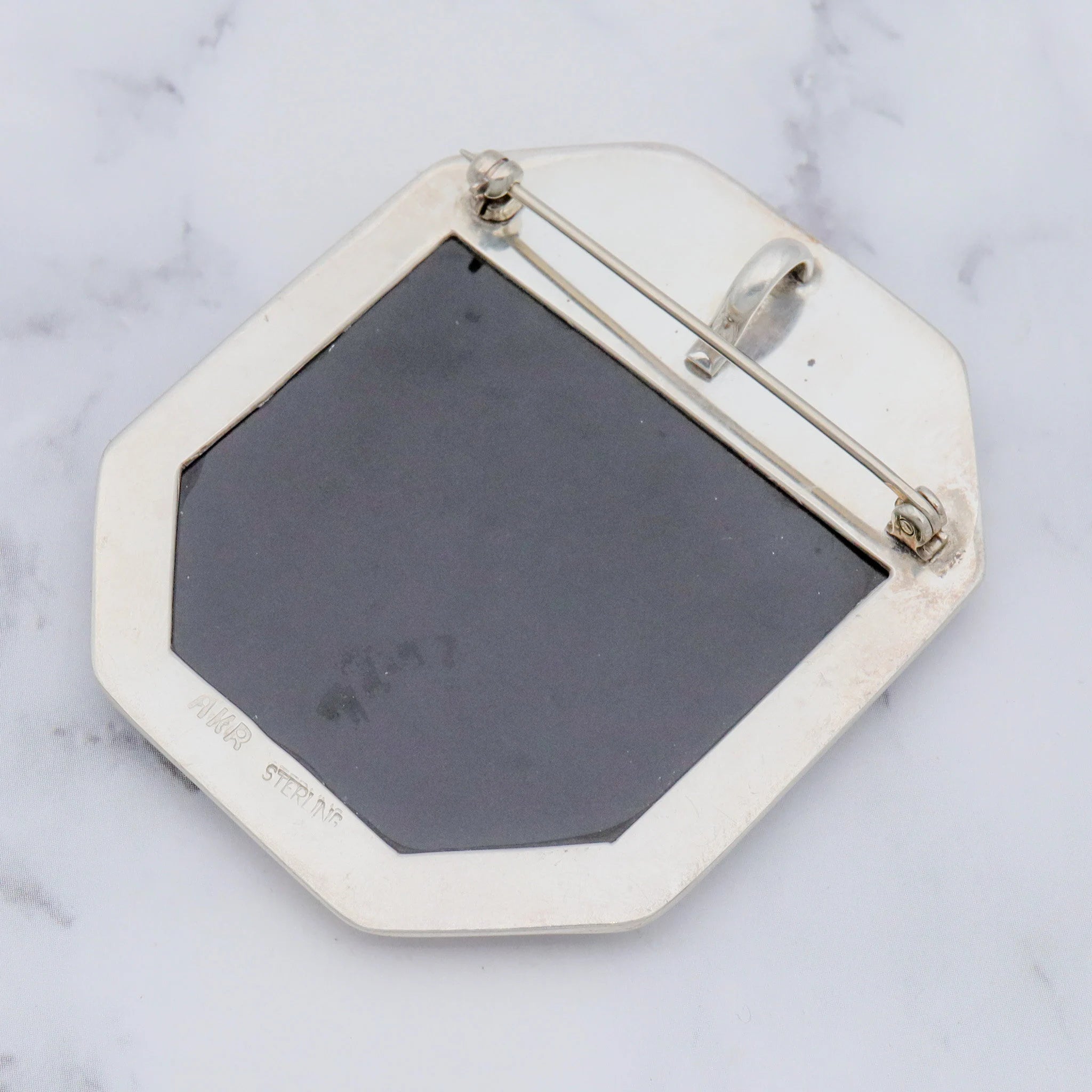 Vintage Amy Kahn Russel sterling, onyx framed dendritic calcite intarsia pendant/brooch