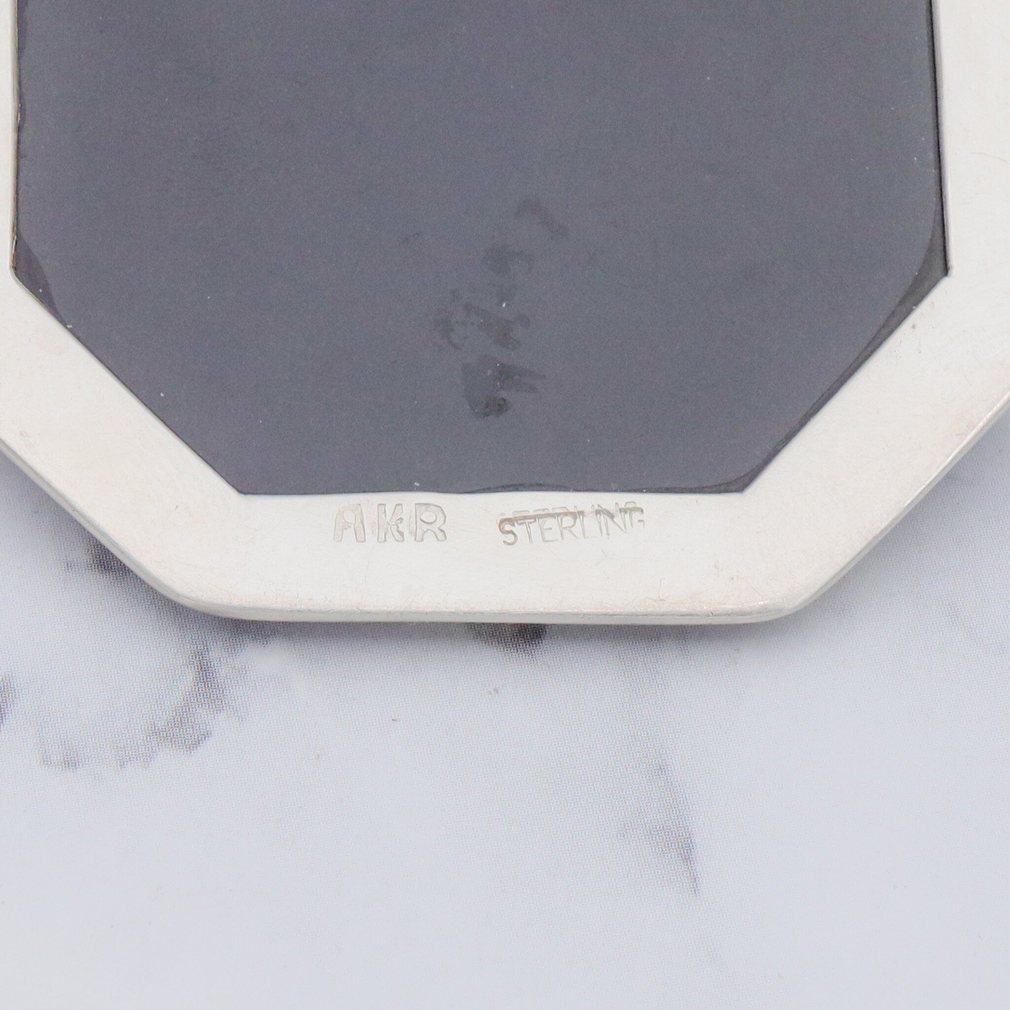 Vintage Amy Kahn Russel sterling, onyx framed dendritic calcite intarsia pendant/brooch