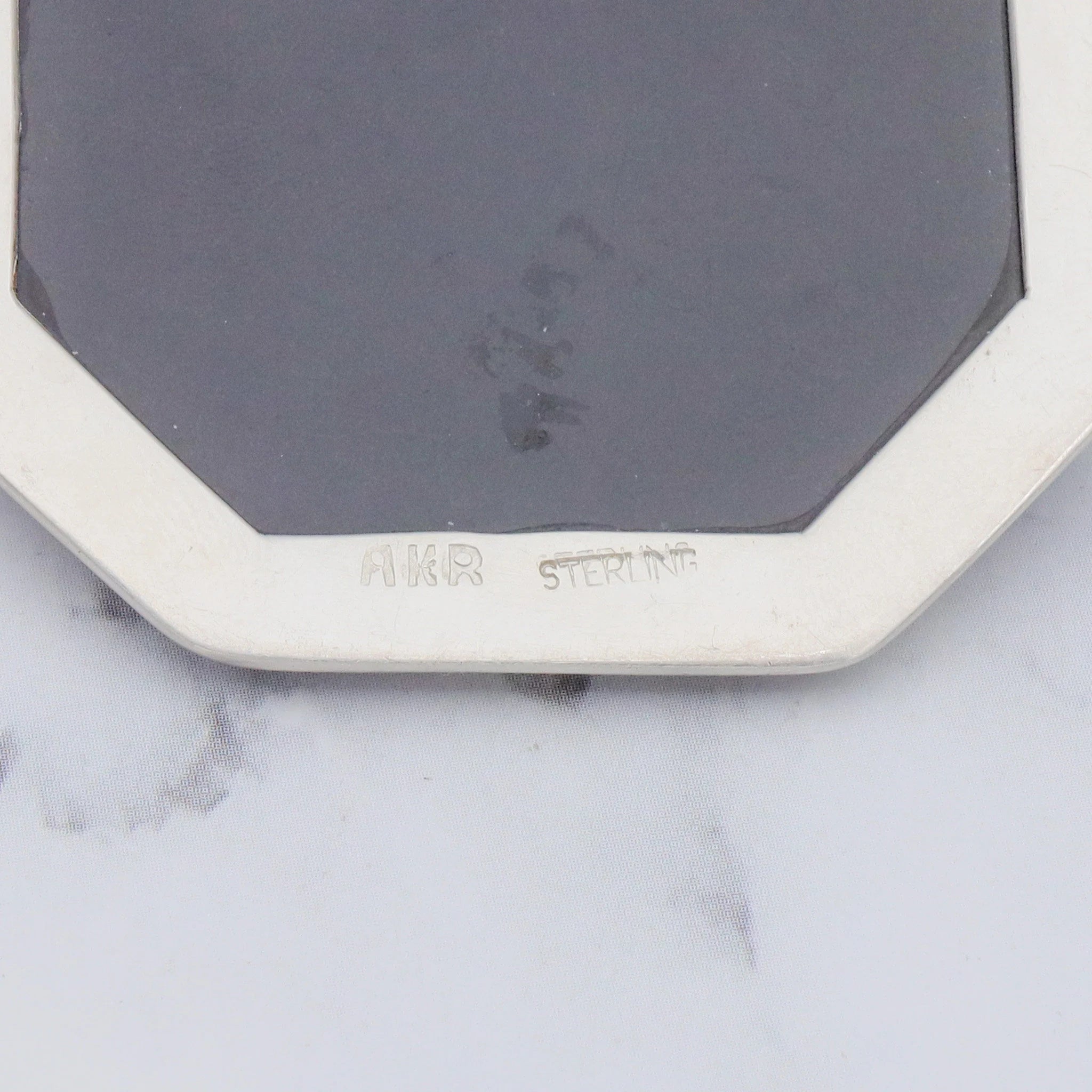 Vintage Amy Kahn Russel sterling, onyx framed dendritic calcite intarsia pendant/brooch