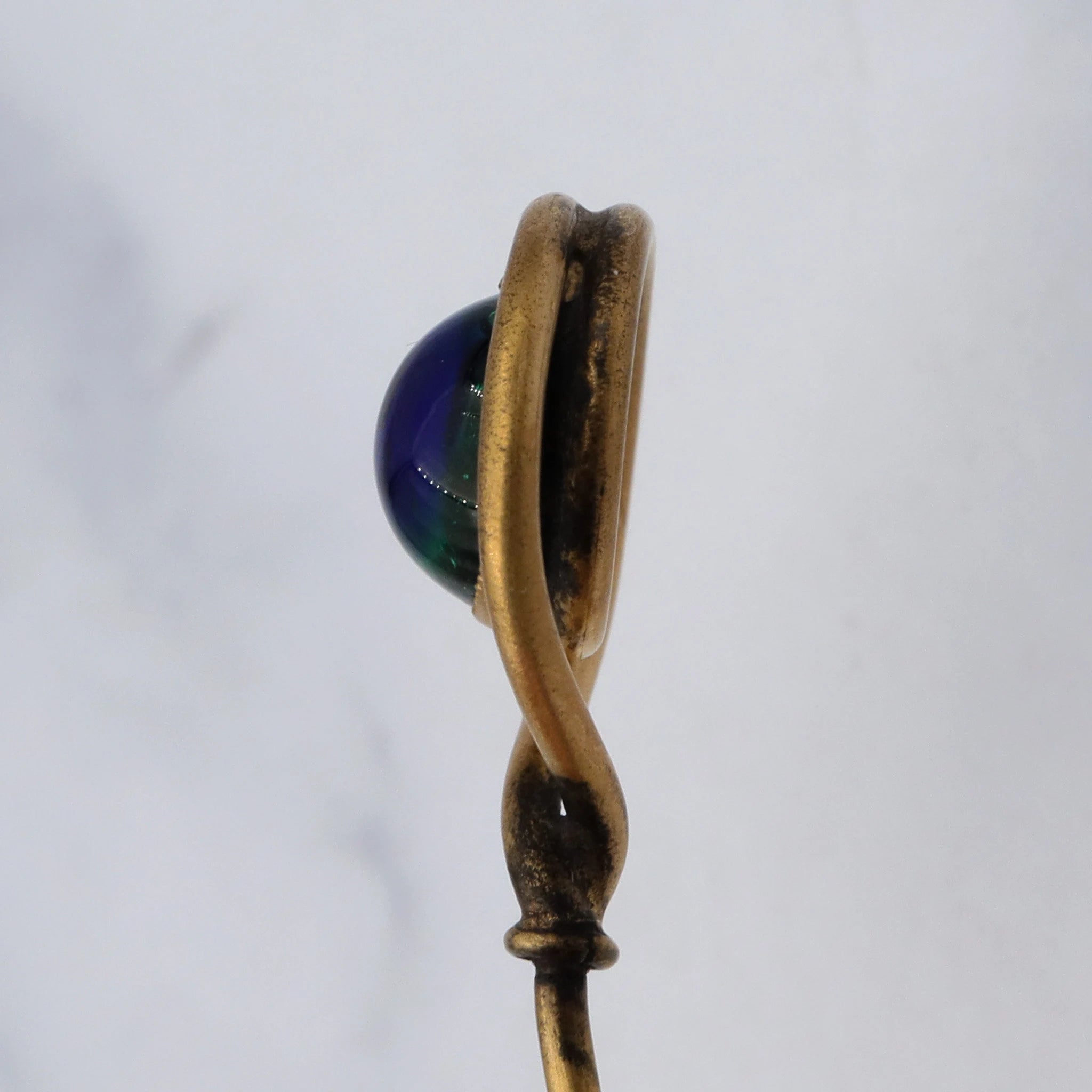 Antique Victorian gilt metal peacock eye glass swirl stick pin