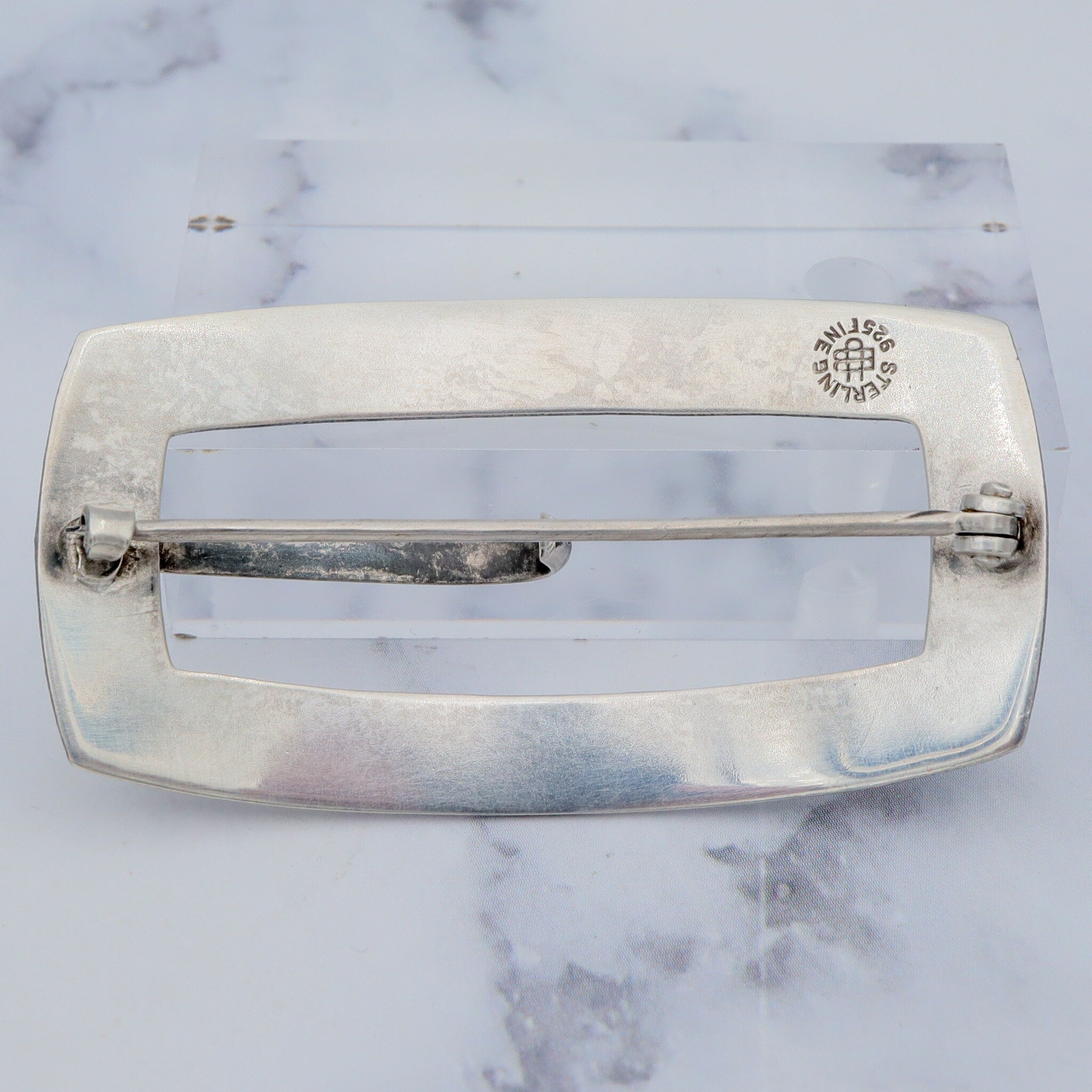 Pair of Antique bright cut engraved sterling Unger Brothers buckle brooches