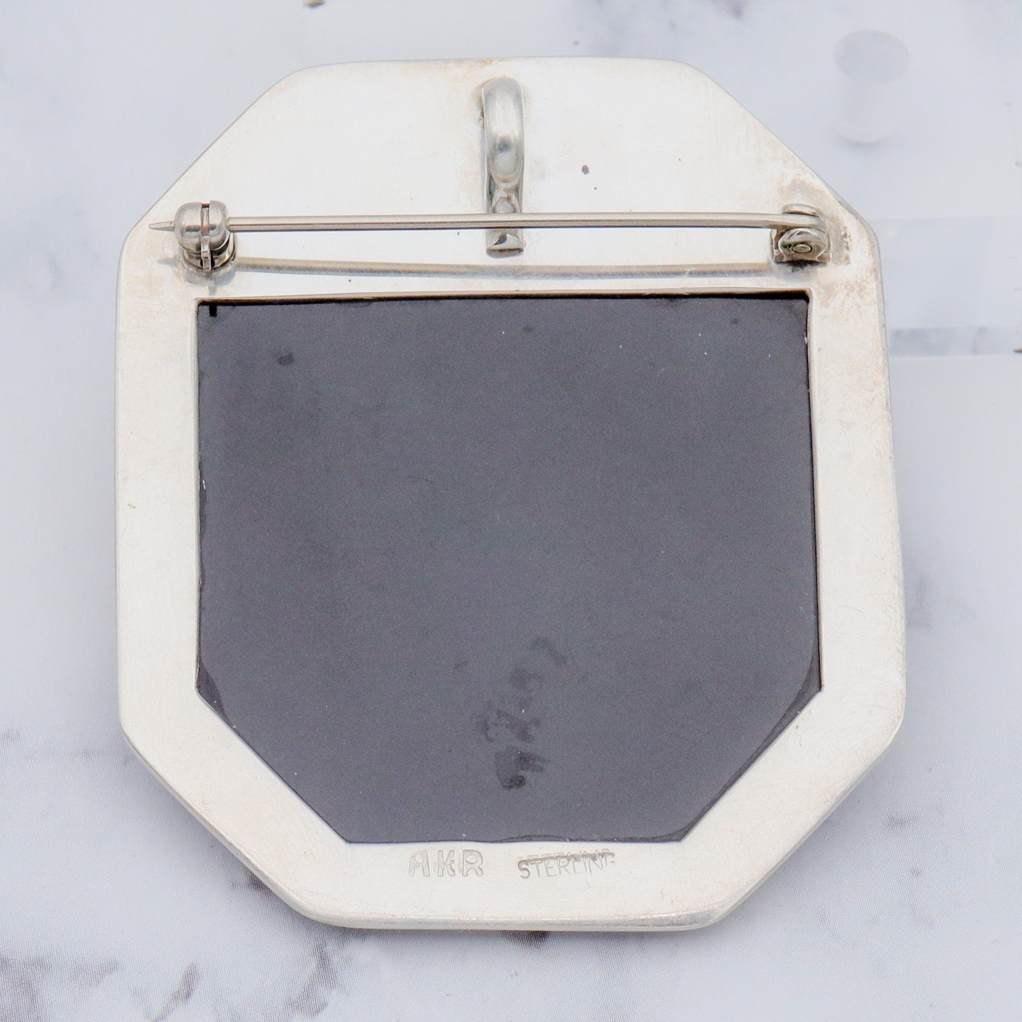 Vintage Amy Kahn Russel sterling, onyx framed dendritic calcite intarsia pendant/brooch