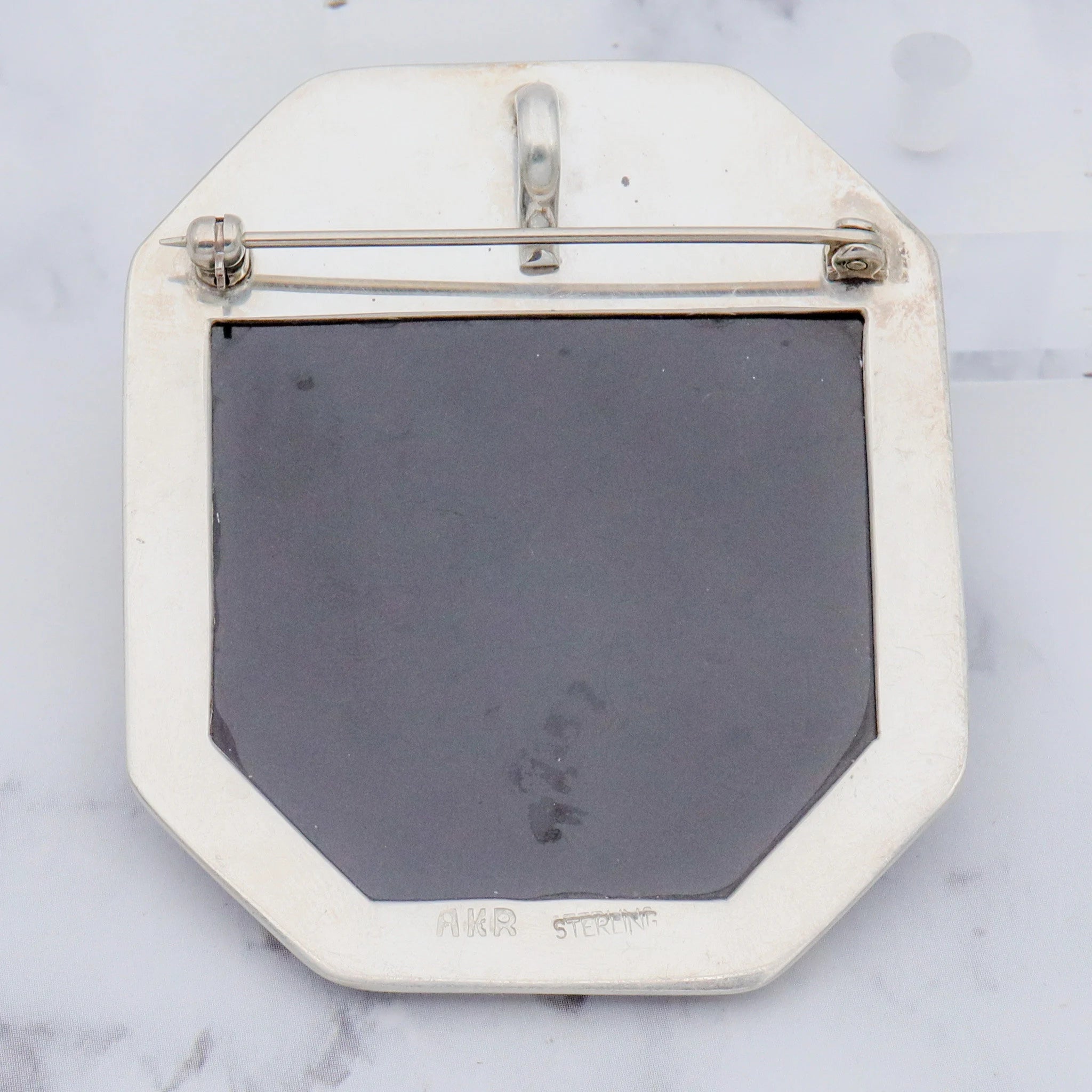 Vintage Amy Kahn Russel sterling, onyx framed dendritic calcite intarsia pendant/brooch