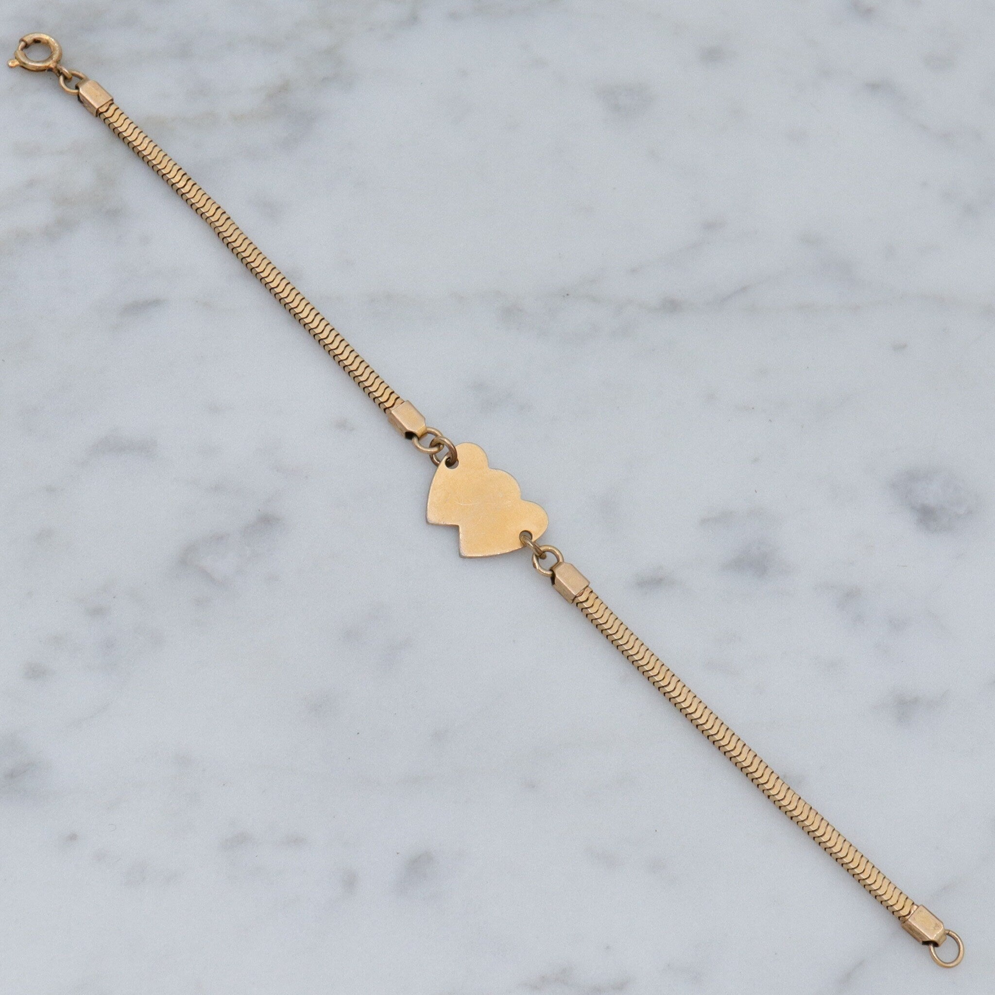 Mid Century gold filled child’s bracelet with double heart name plaque