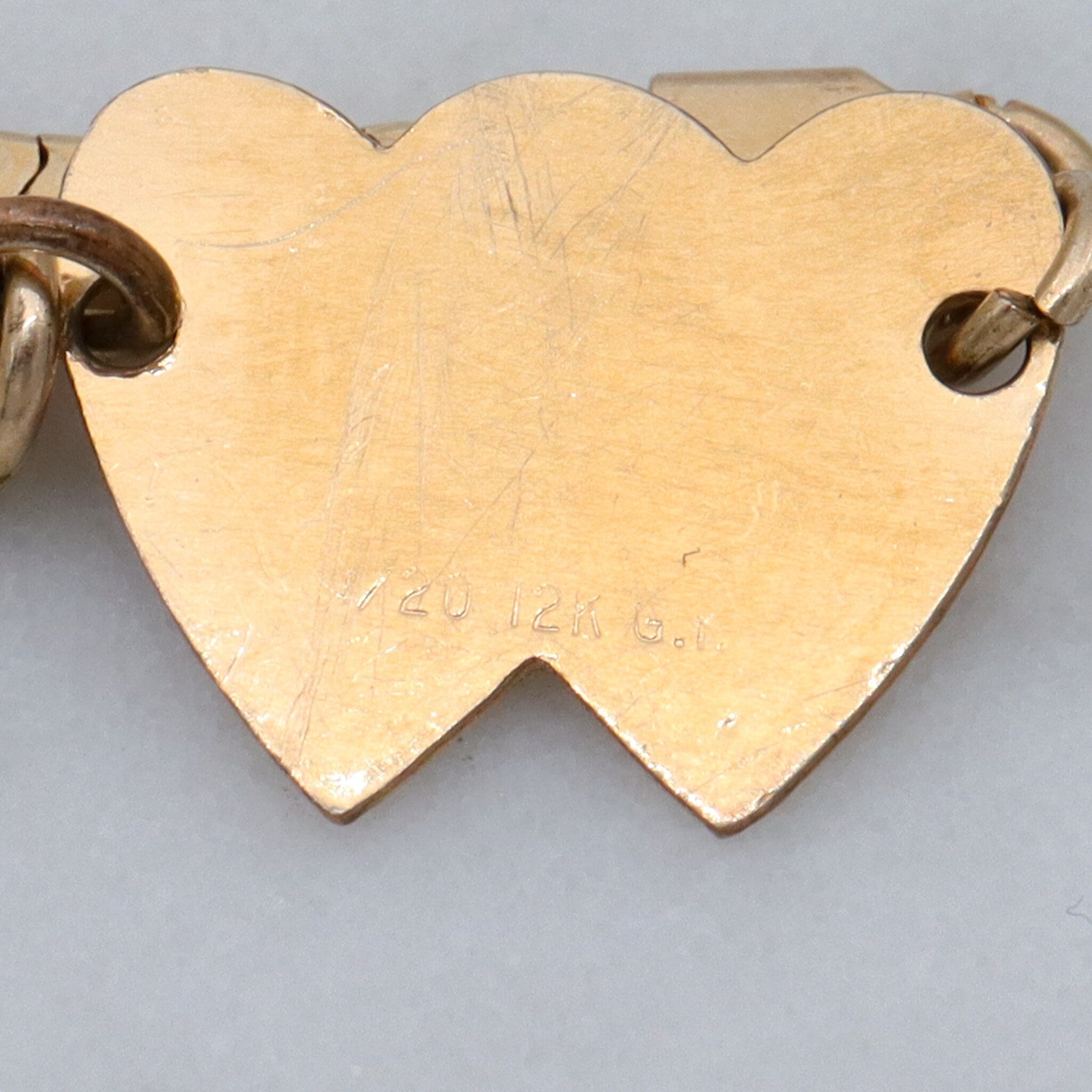 Mid Century gold filled child’s bracelet with double heart name plaque