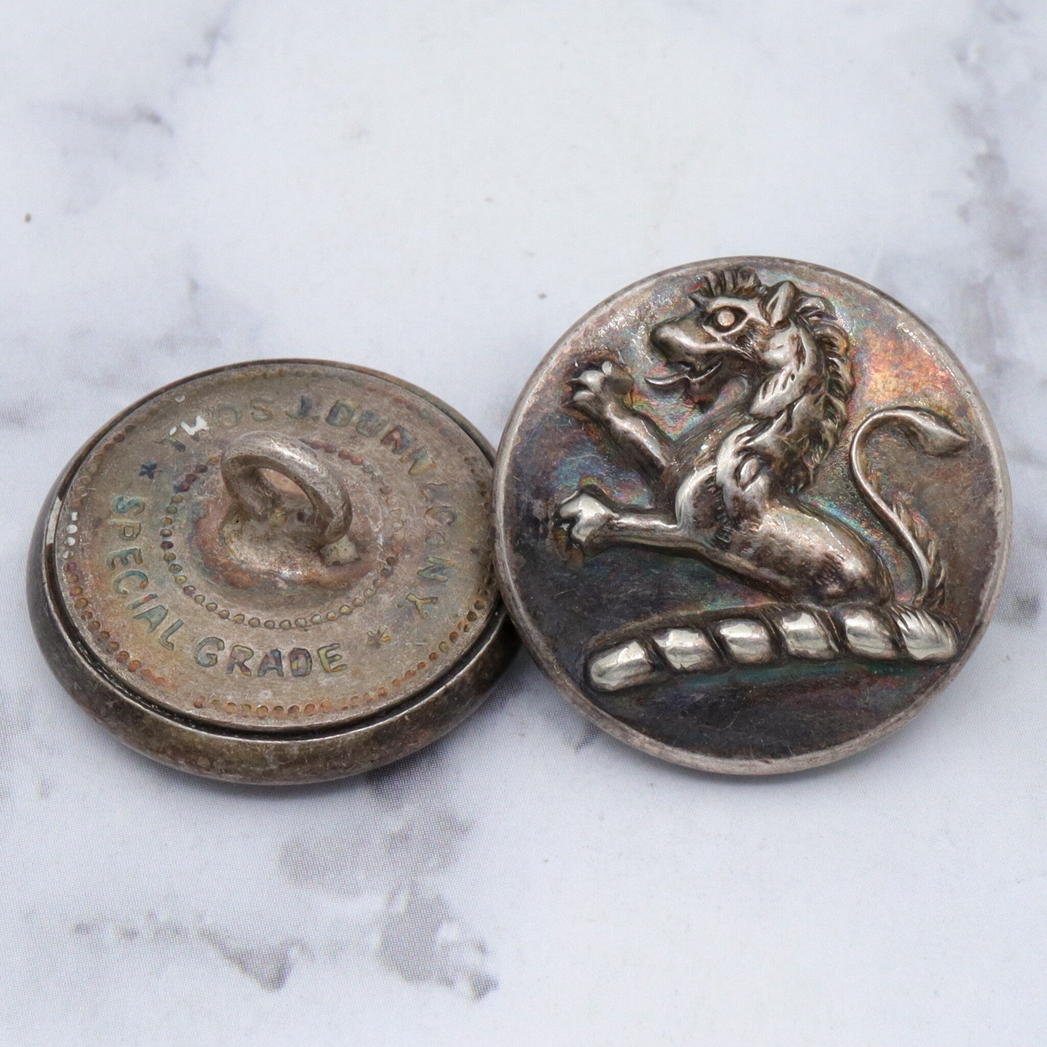 Large group of 28 Antique silver plated brass livery buttons with rampant lion