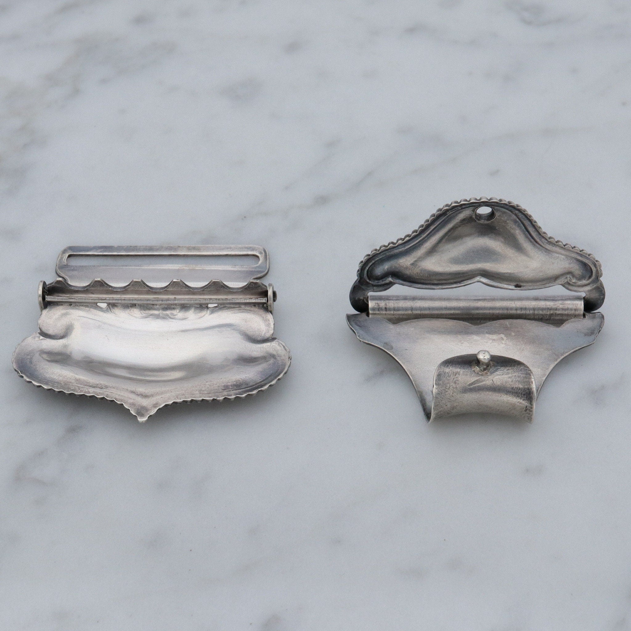 Pair of Antique sterling suspender buckle clips by Sloan & Co.