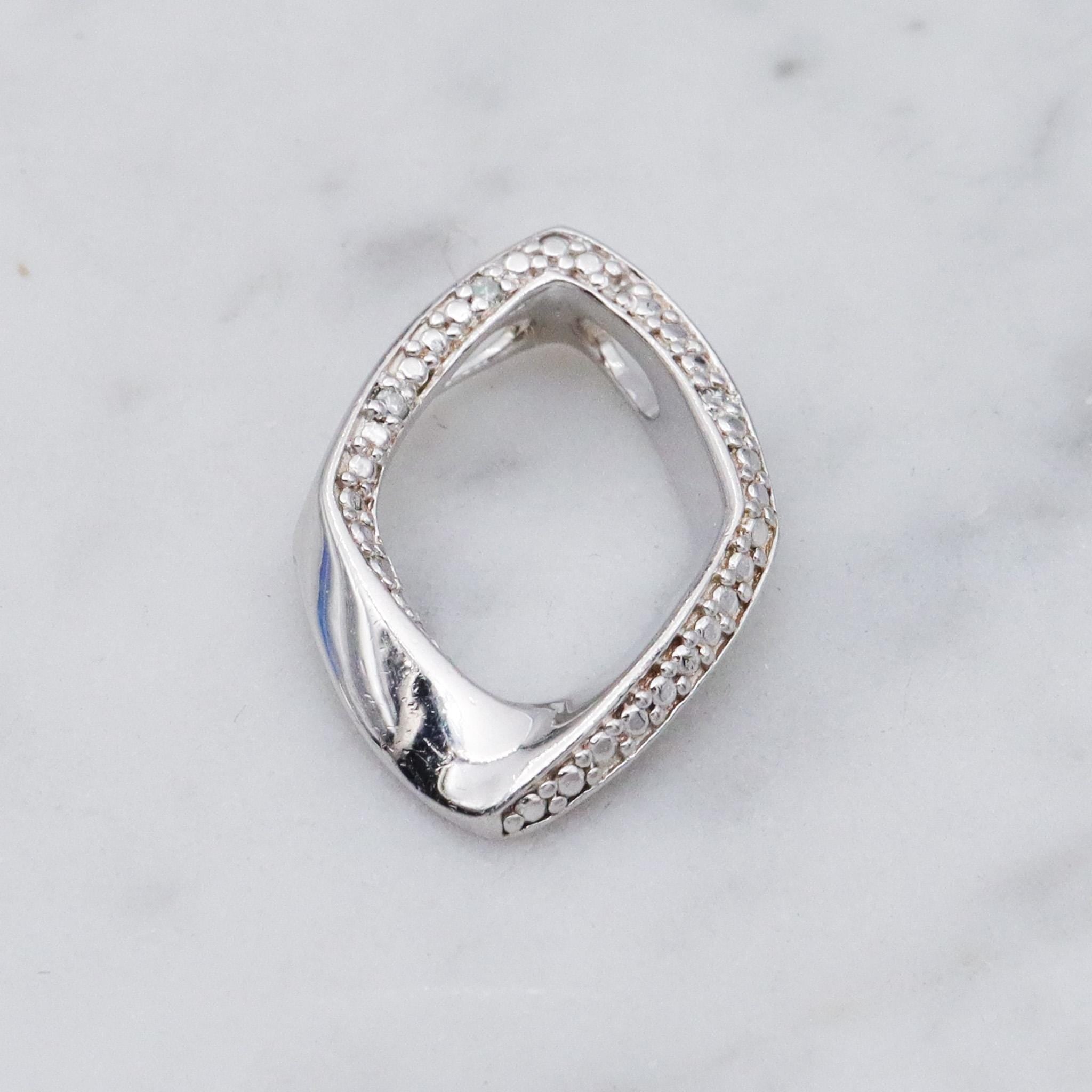 Vintage sterling silver and diamond abstract pendant