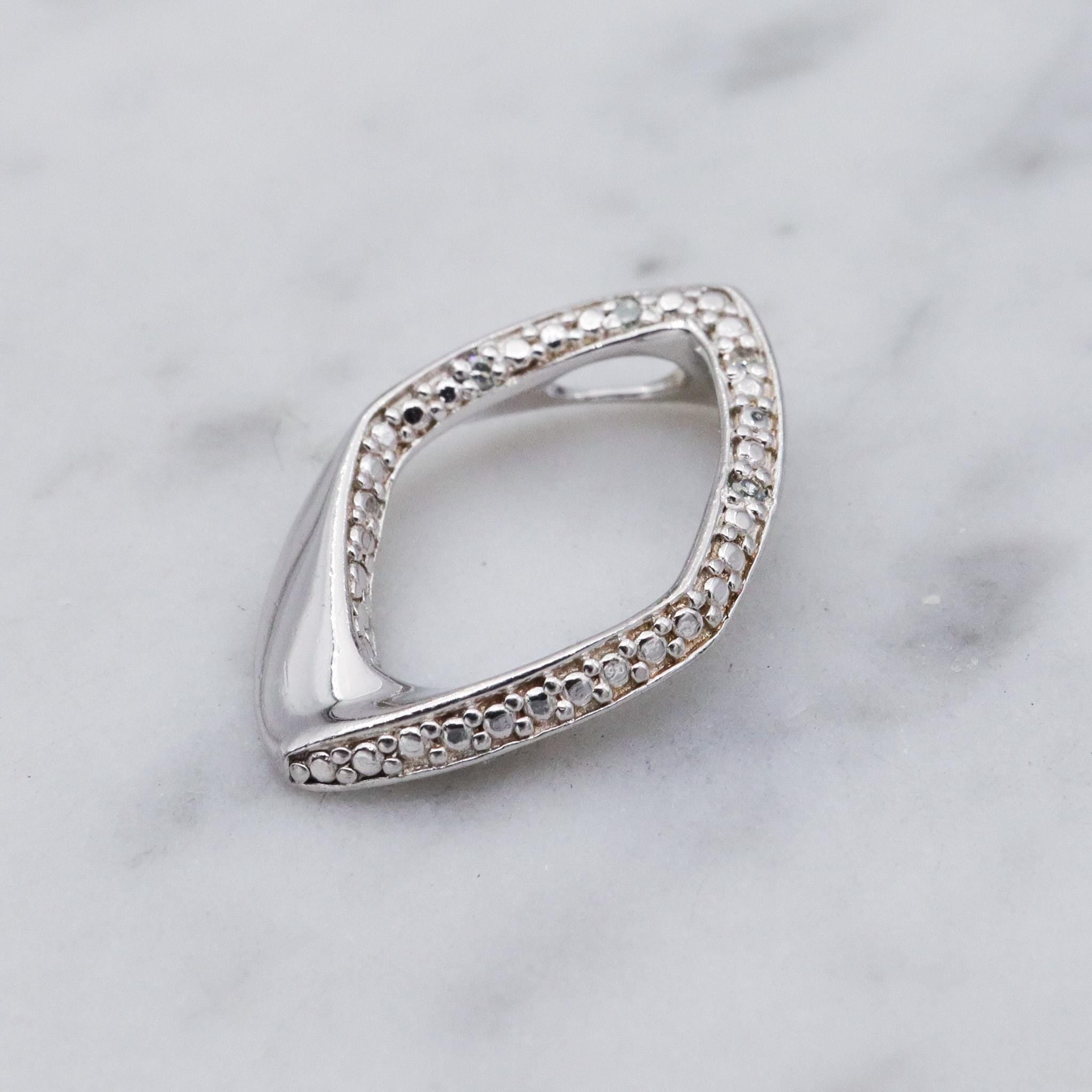 Vintage sterling silver and diamond abstract pendant