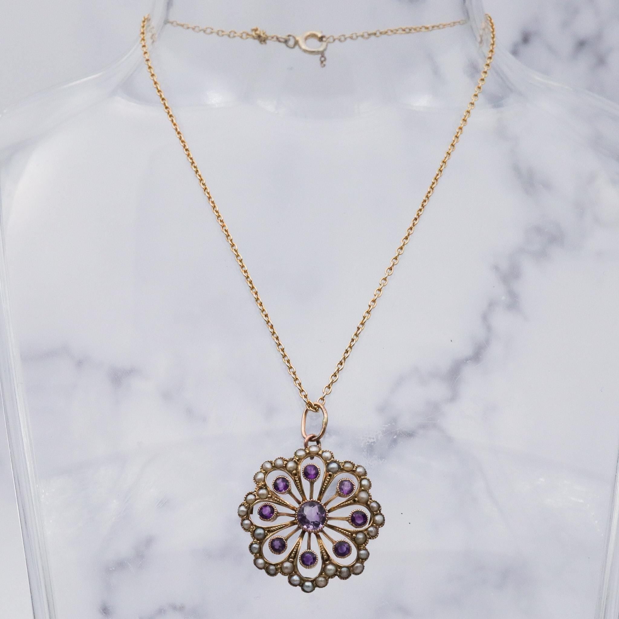 Antique early Victorian 9k gold, amethyst and split pearl flower pendant