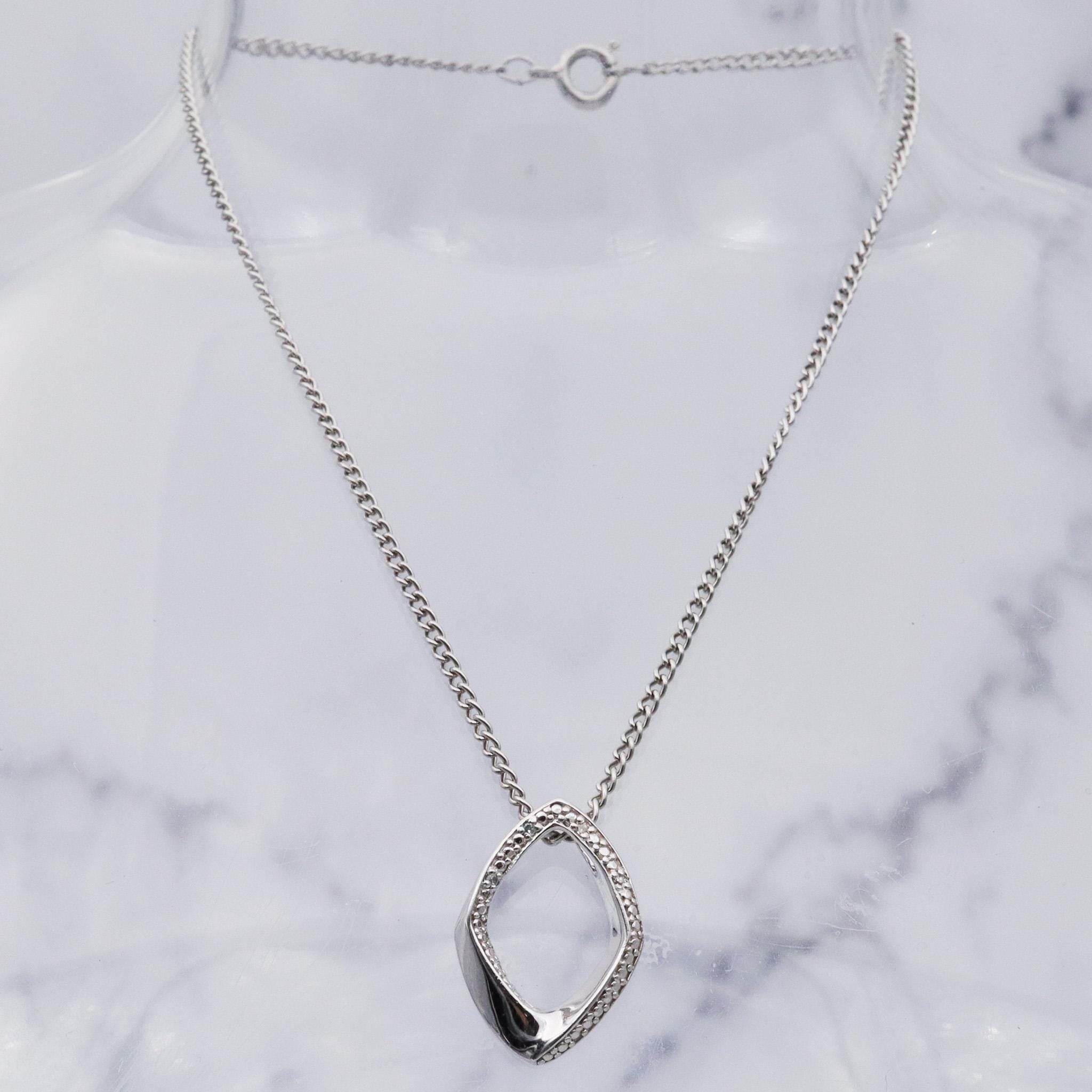 Vintage sterling silver and diamond abstract pendant