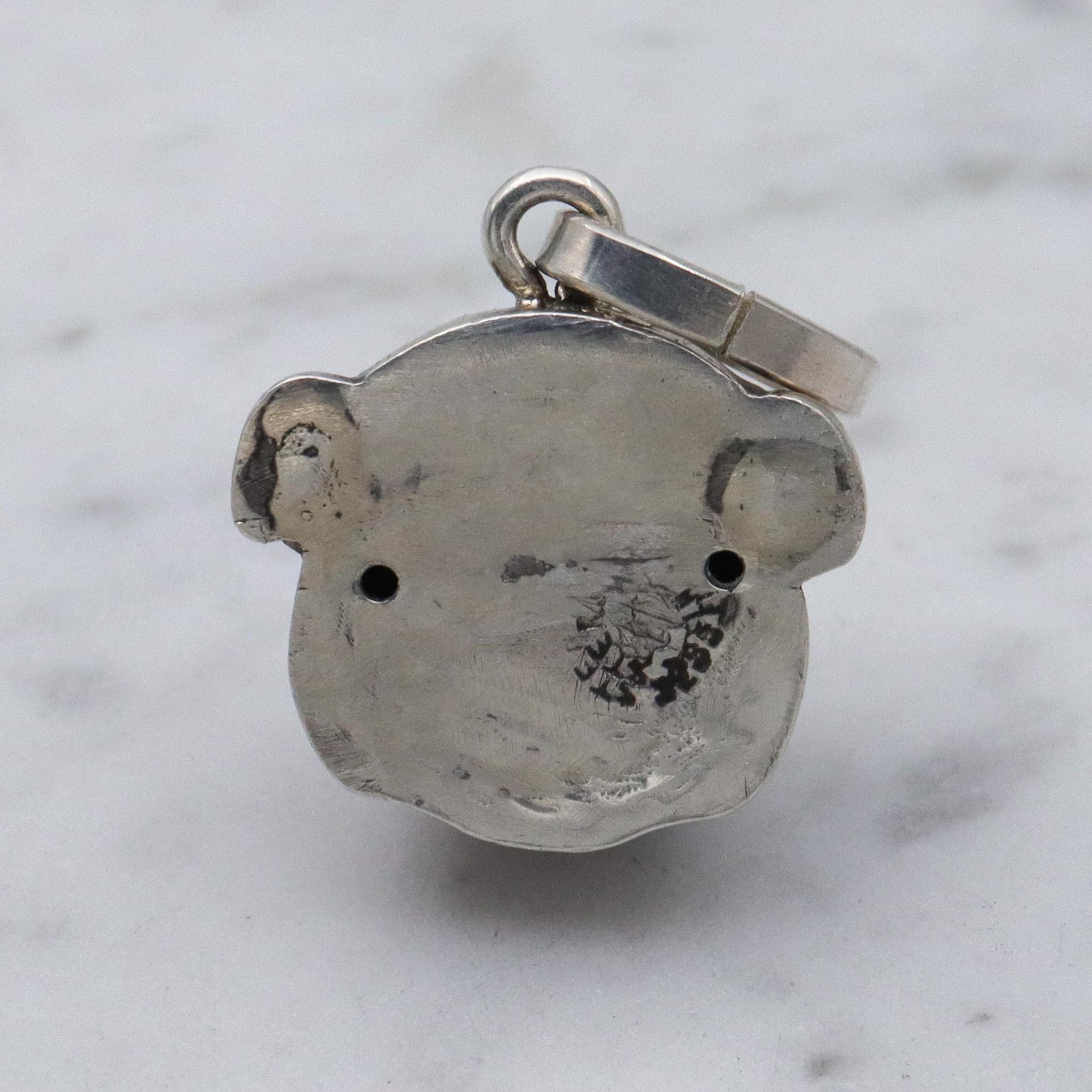 Antique Unger Brothers sterling silver bulldog with ruby glass eyes pendant