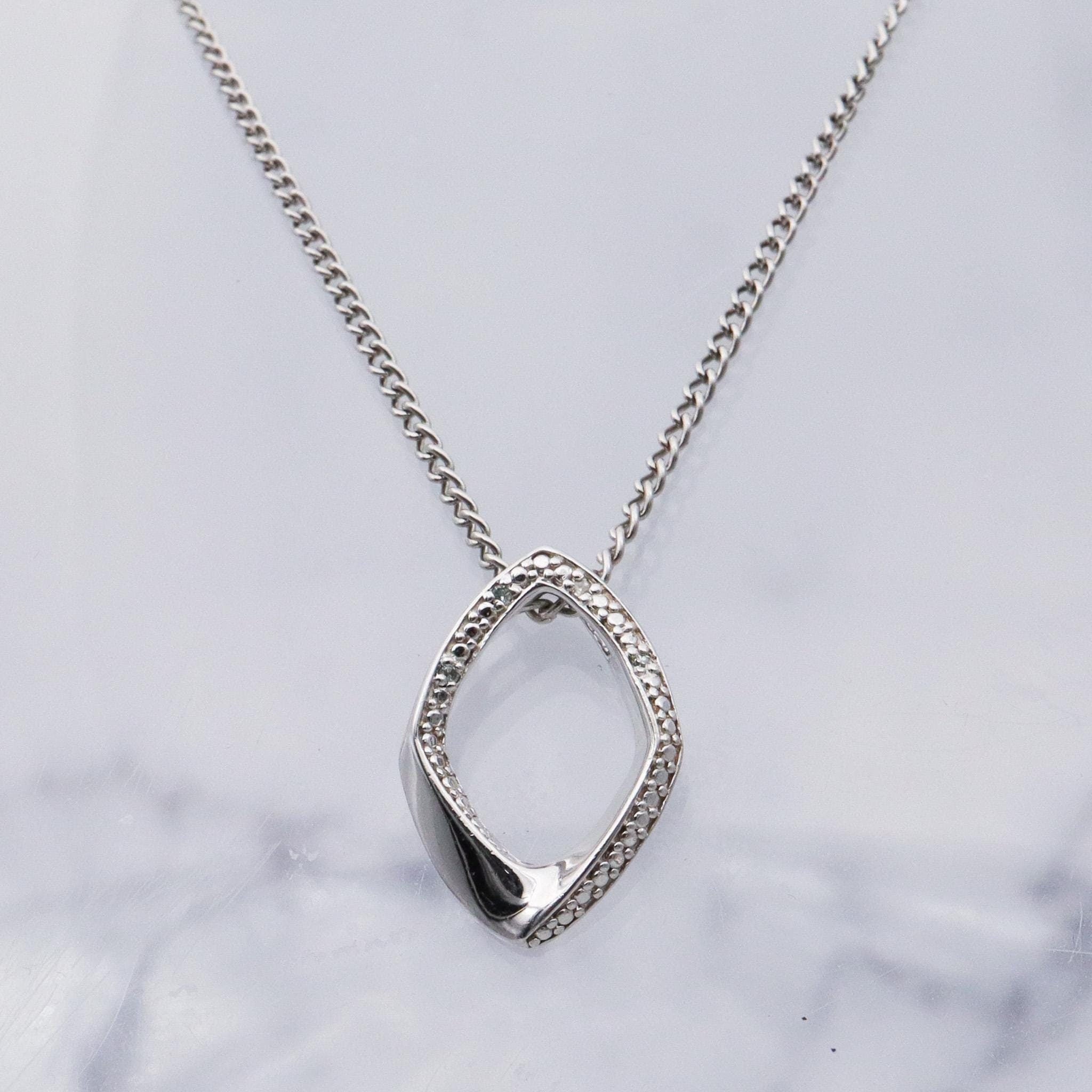 Vintage sterling silver and diamond abstract pendant