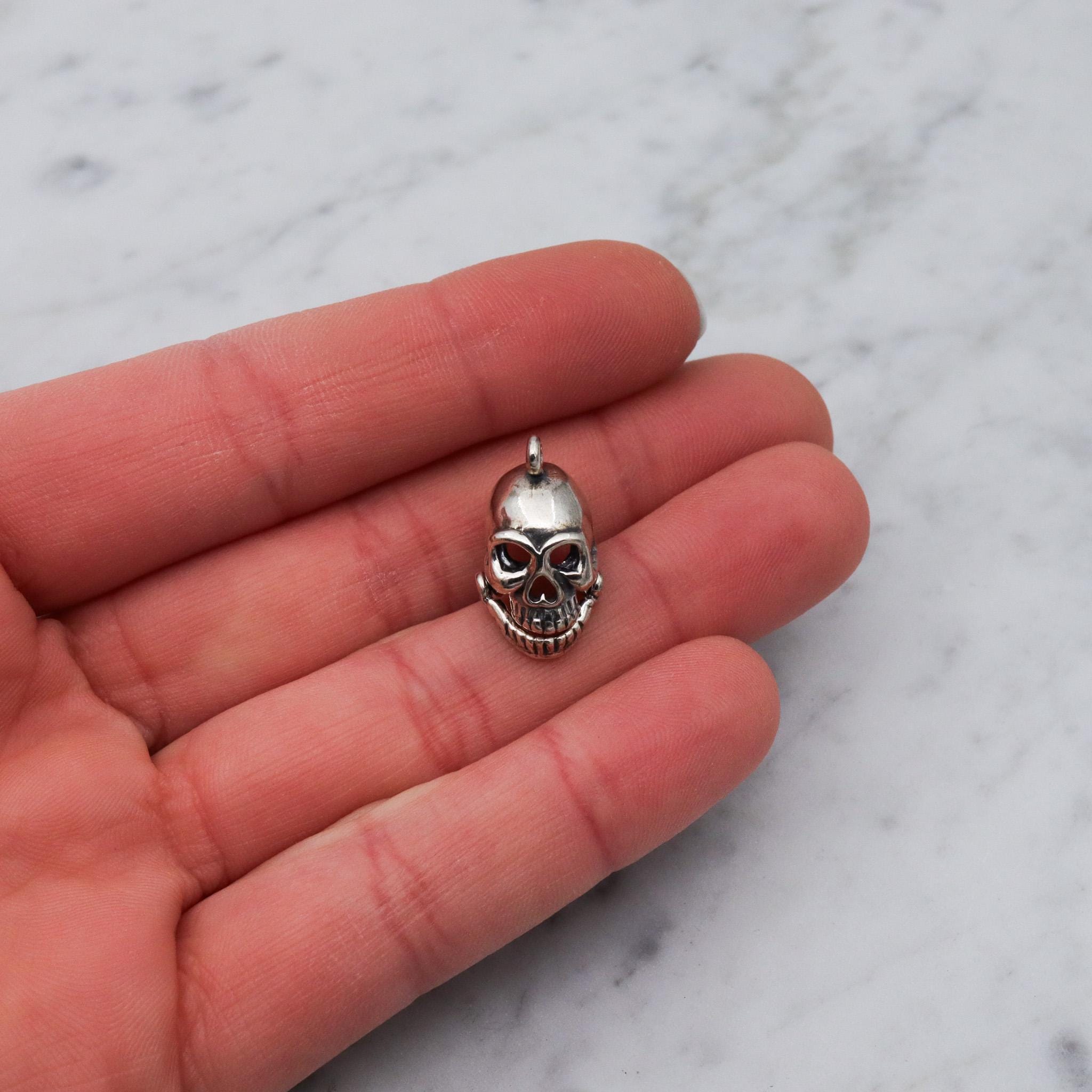 Vintage sterling silver hinged jaw skull pendants