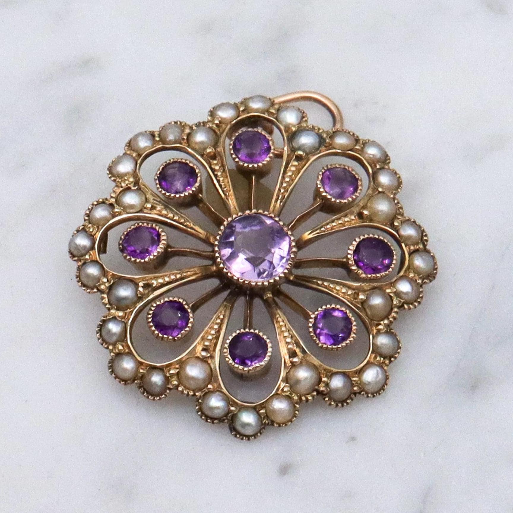 Antique early Victorian 9k gold, amethyst and split pearl flower pendant
