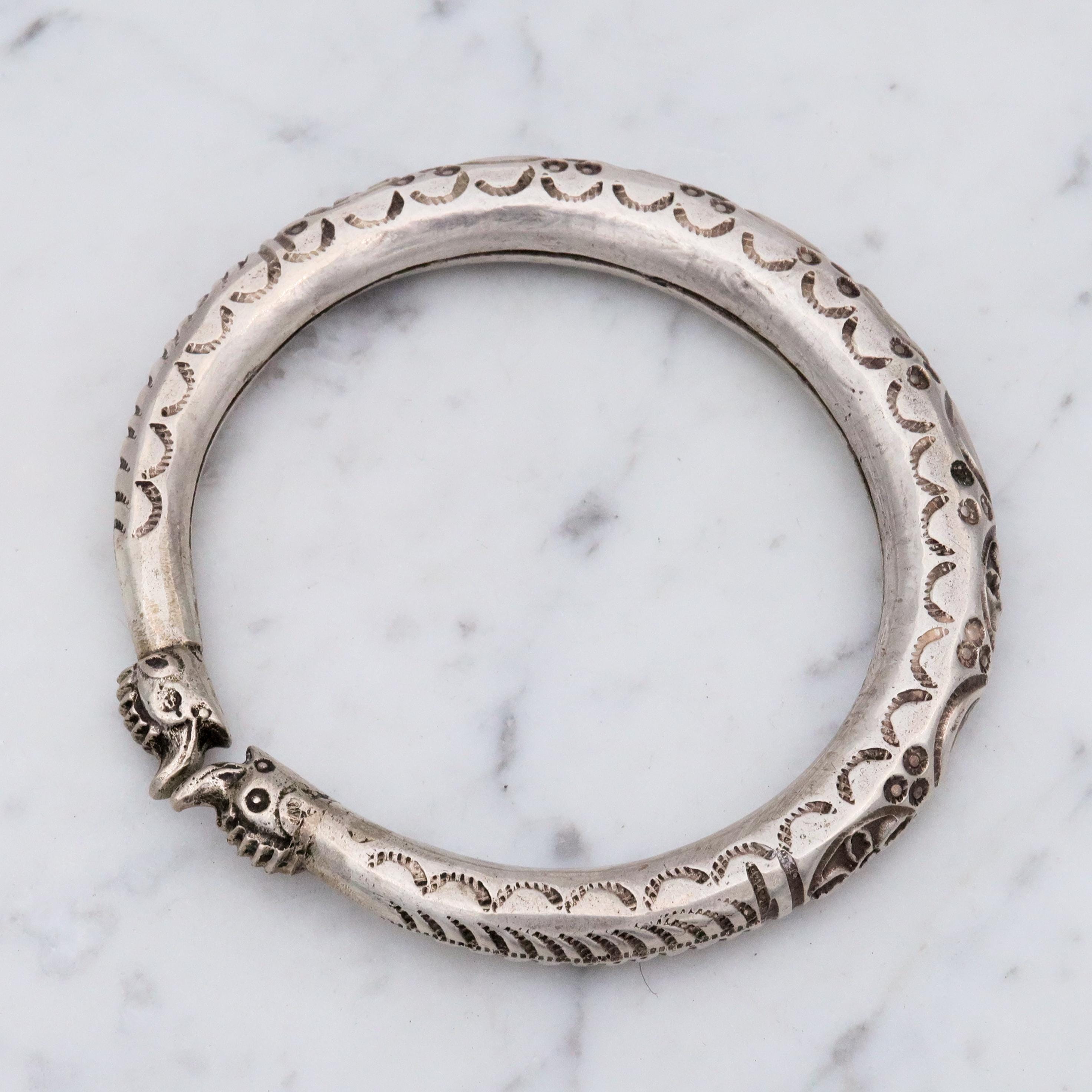 Vintage tribal engraved sterling hollow elephant head bangle