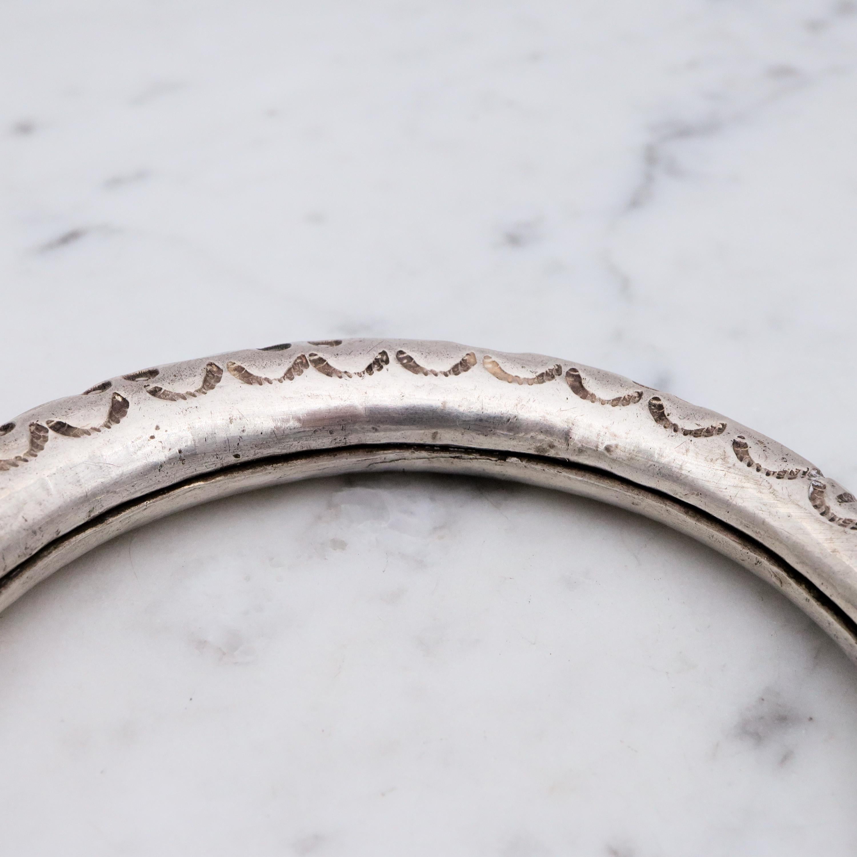 Vintage tribal engraved sterling hollow elephant head bangle