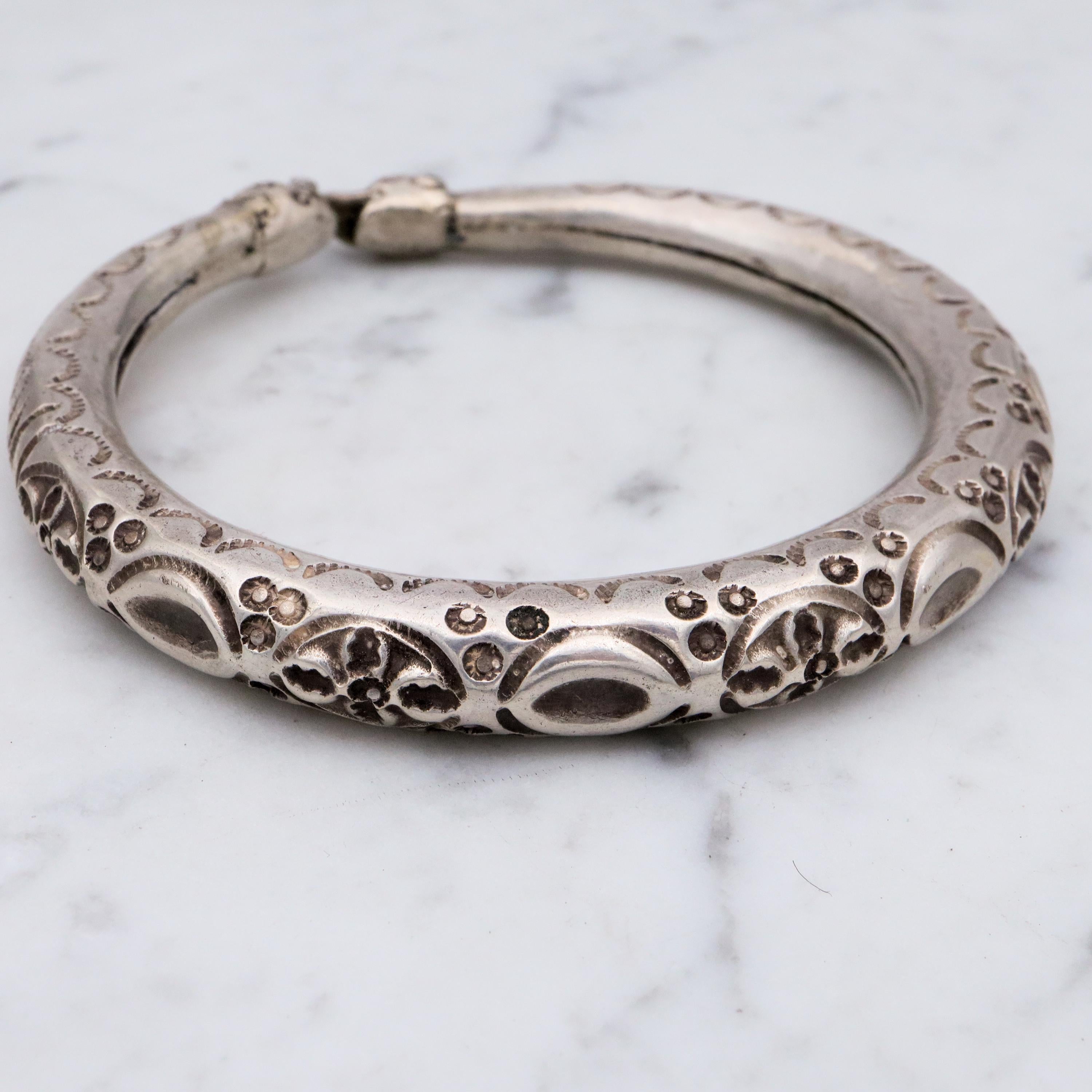 Vintage tribal engraved sterling hollow elephant head bangle