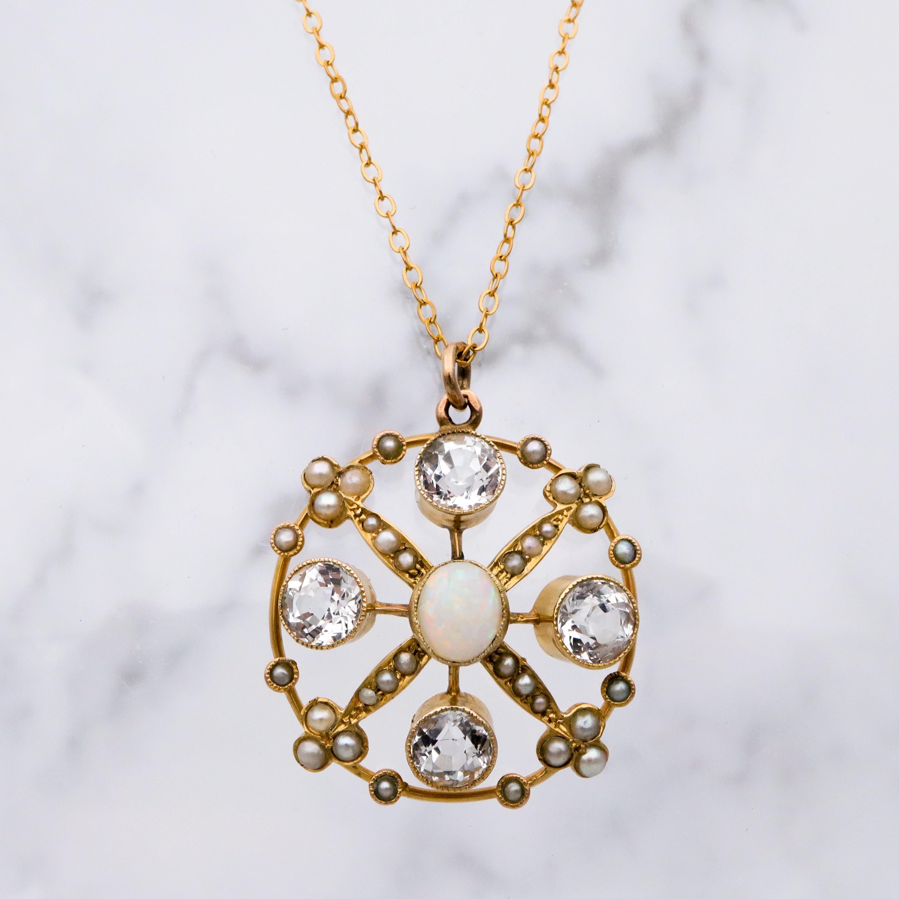 Antique Belle Epoque opal, white topaz, & pearl 9k gold circle pendant