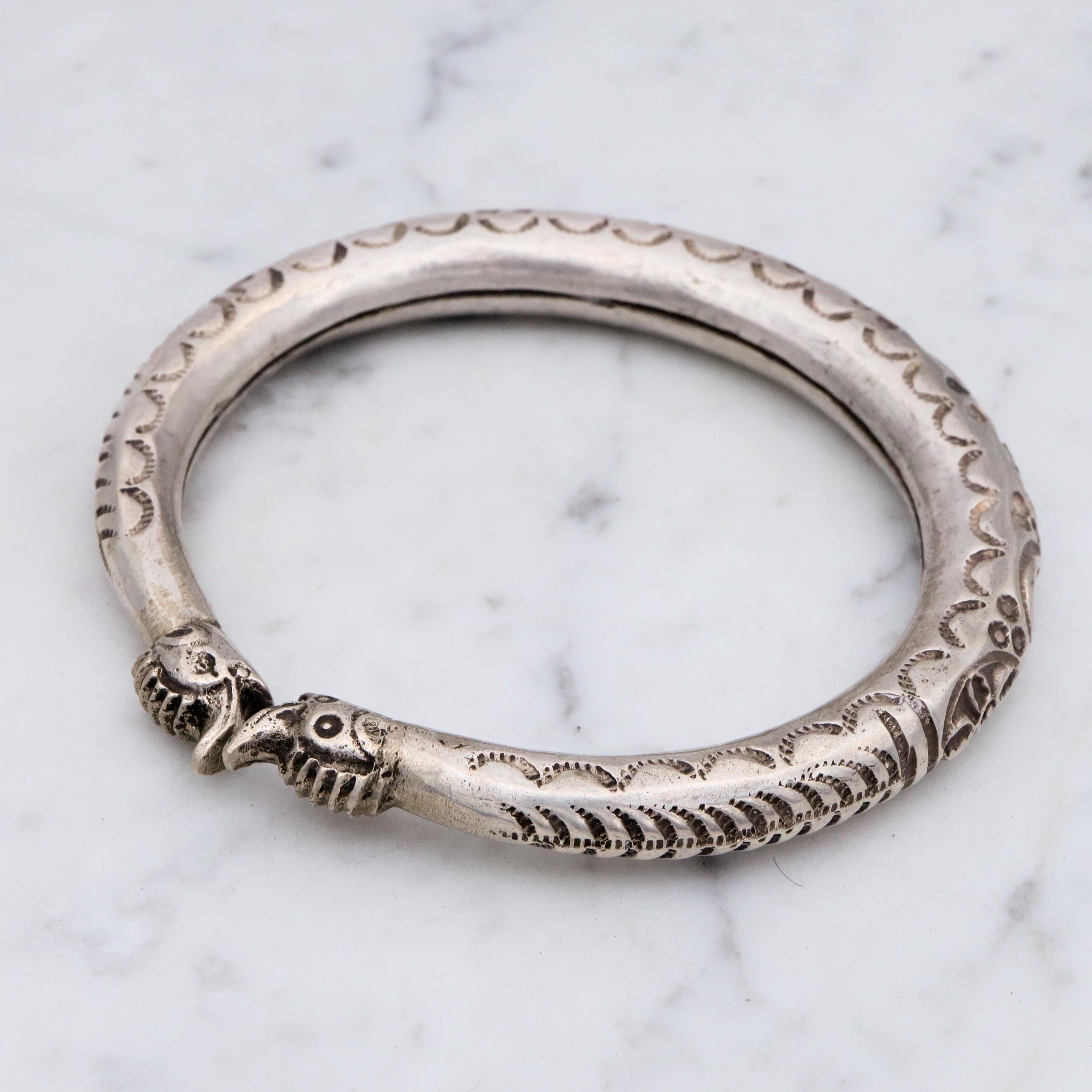 Vintage tribal engraved sterling hollow elephant head bangle