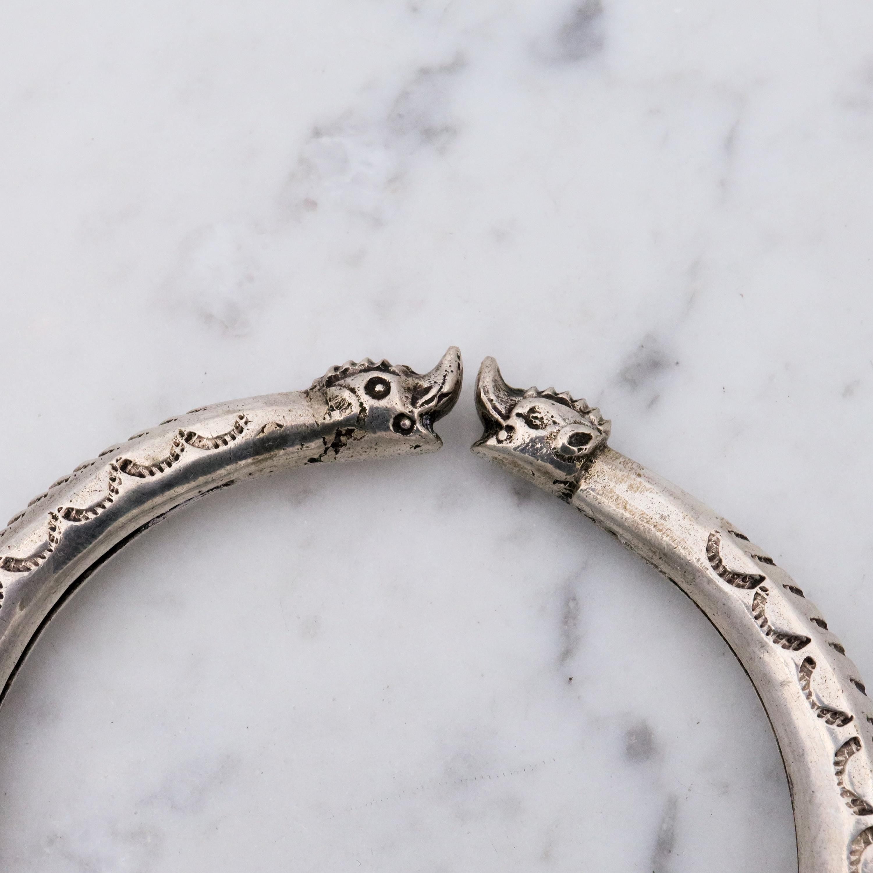 Vintage tribal engraved sterling hollow elephant head bangle