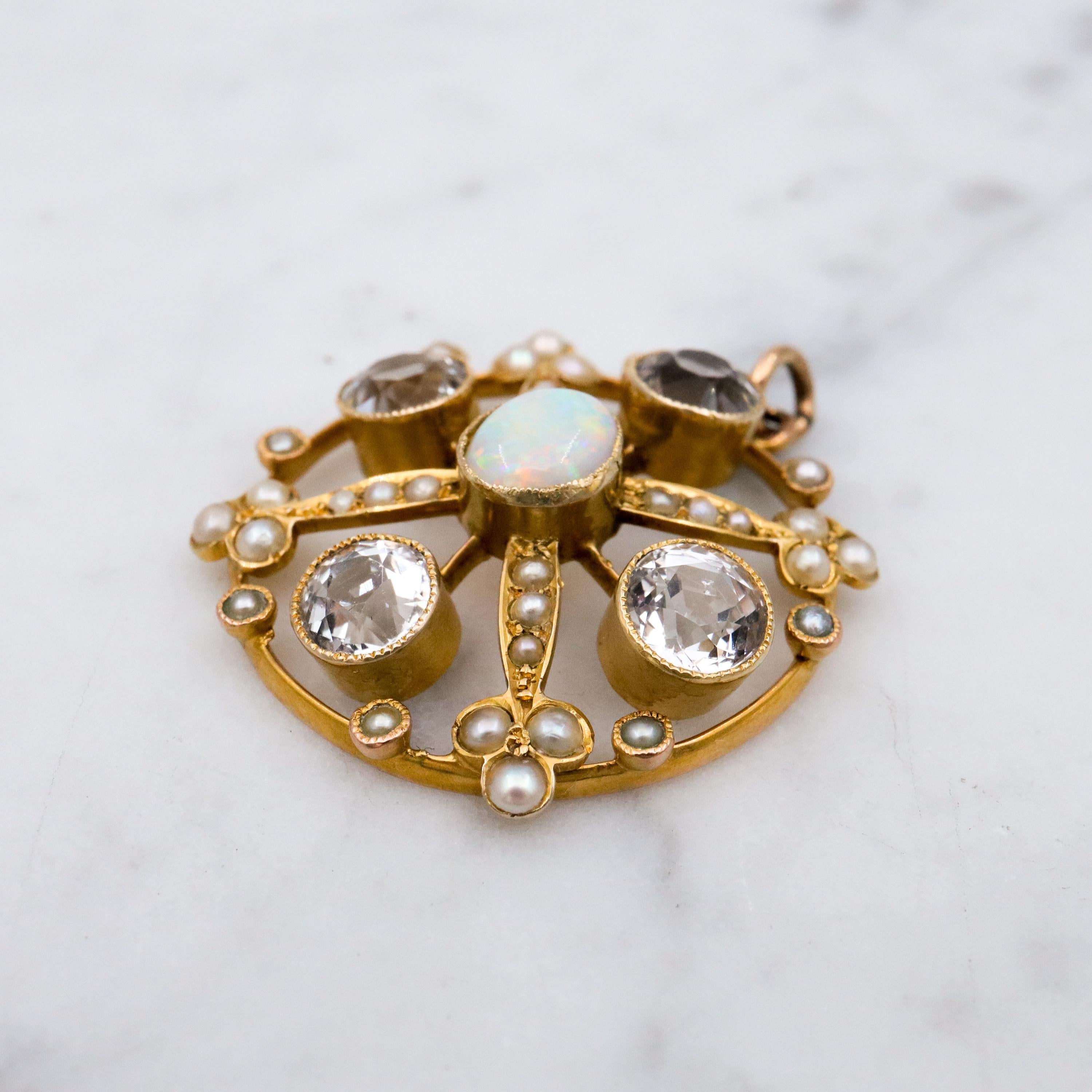 Antique Belle Epoque opal, white topaz, & pearl 9k gold circle pendant