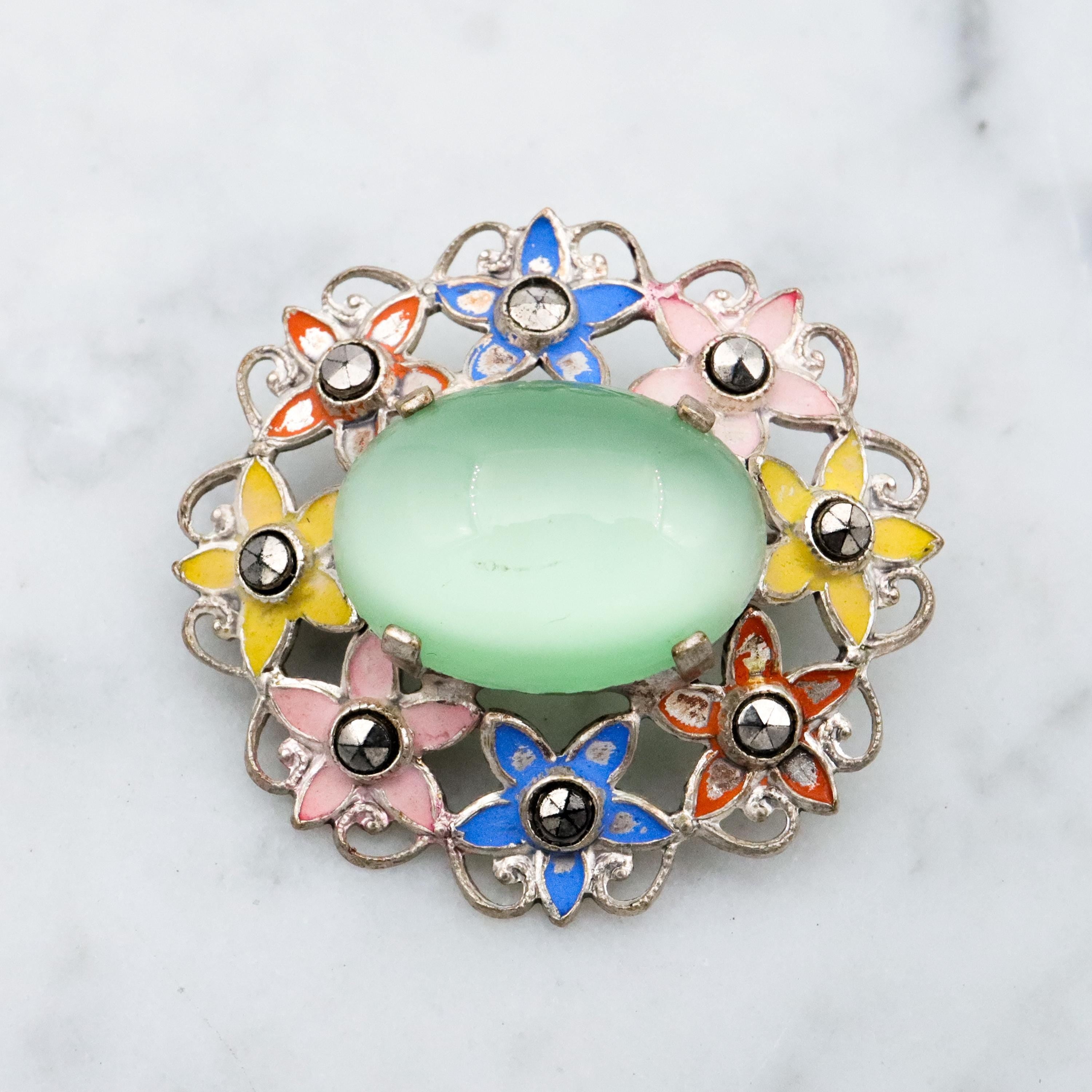 Antique Art Deco green cats eye enamel flower brooch