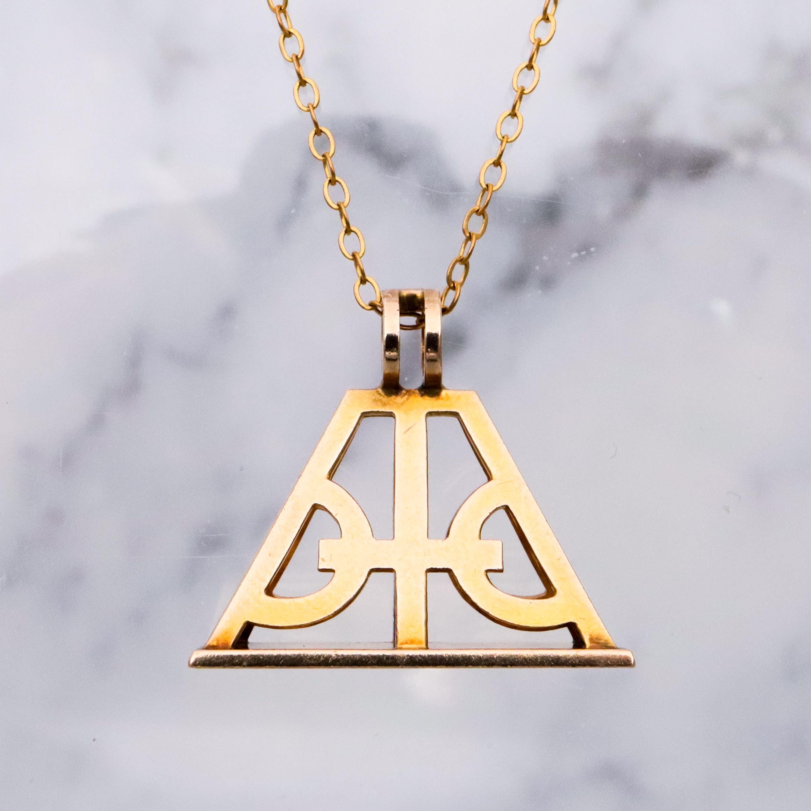 Antique Victorian 10k gold geometric cutout fob pendant