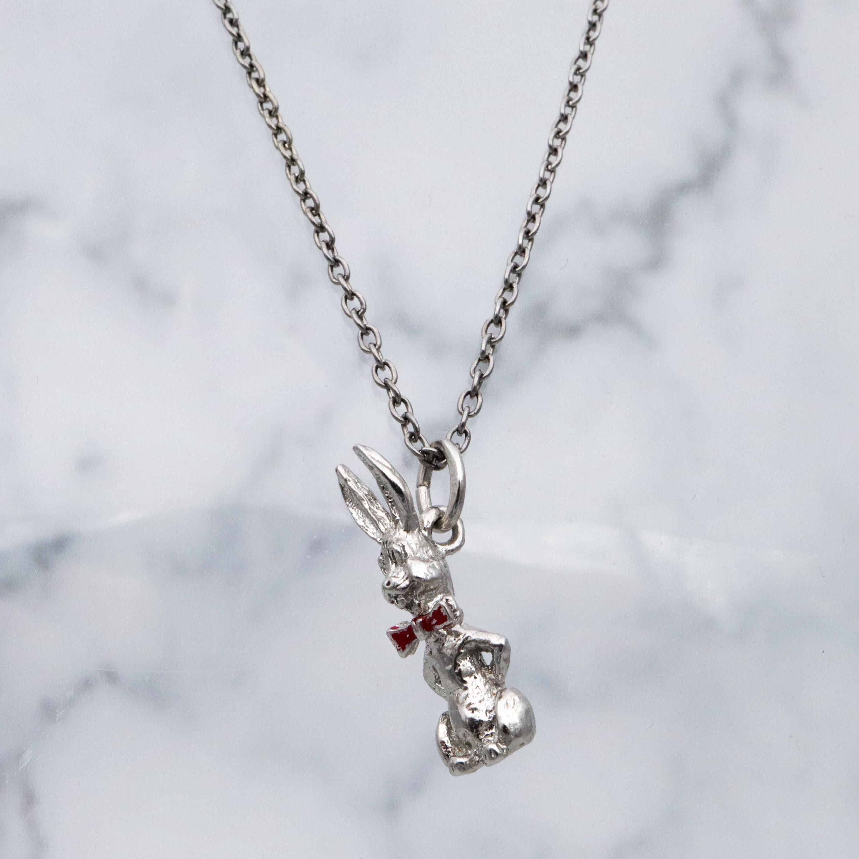 Vintage sterling seated bunny with red bowtie & nodding head