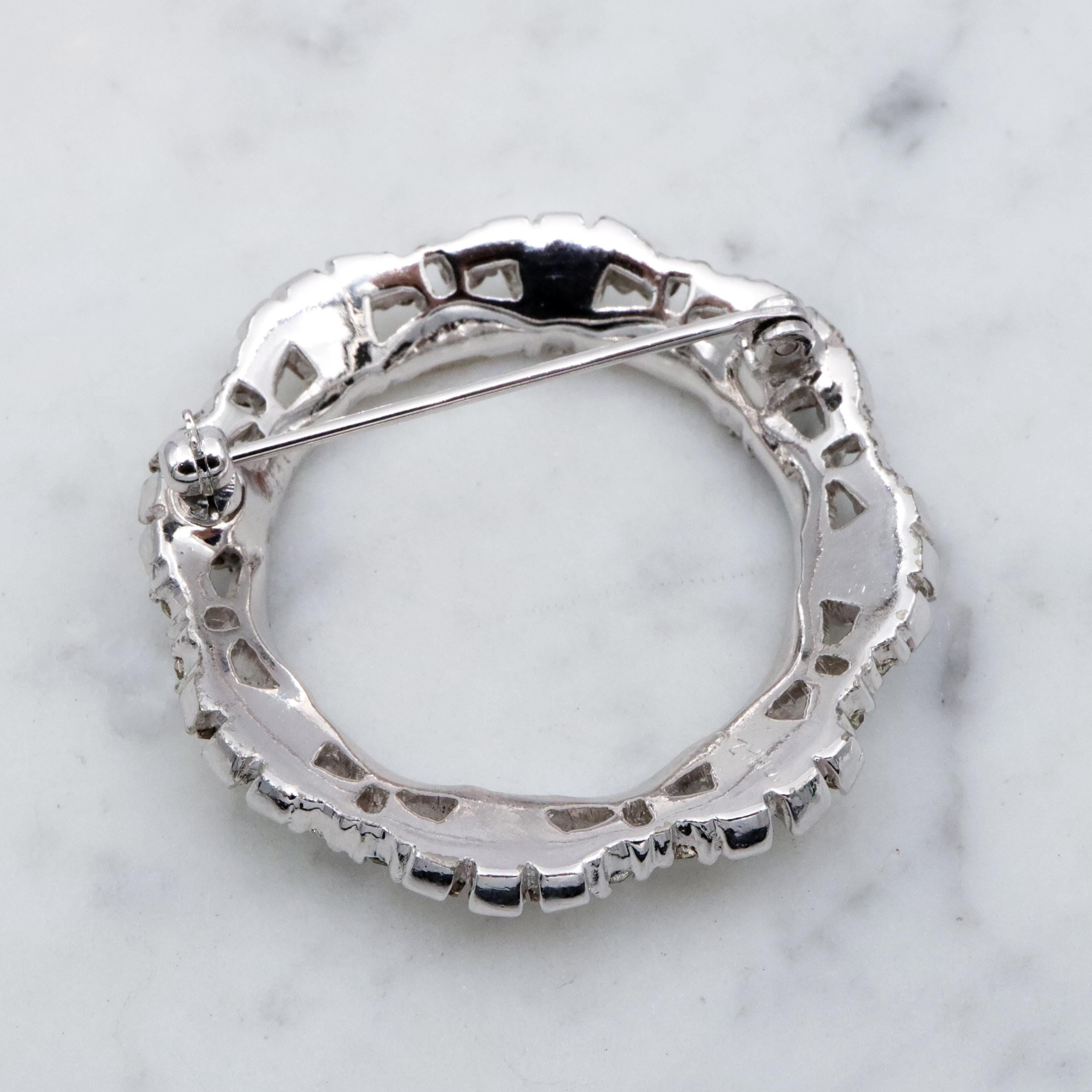 Deco Revival Jomaz rhodium plated rhinestone open wreath brooch