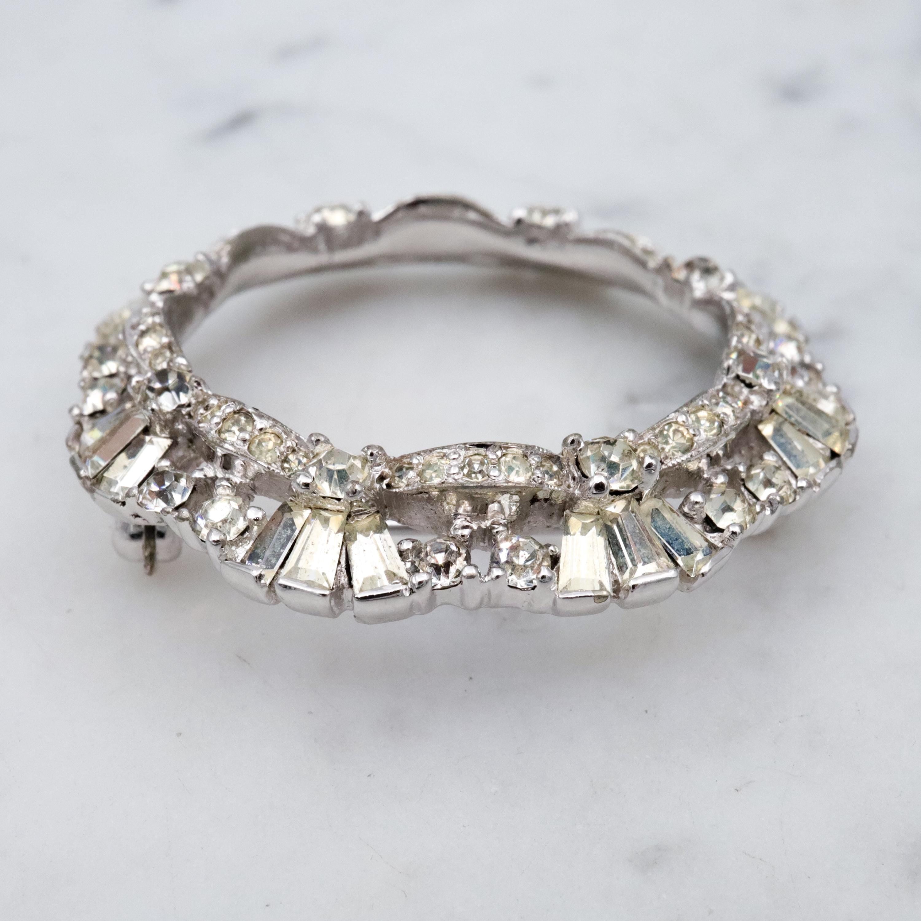 Deco Revival Jomaz rhodium plated rhinestone open wreath brooch