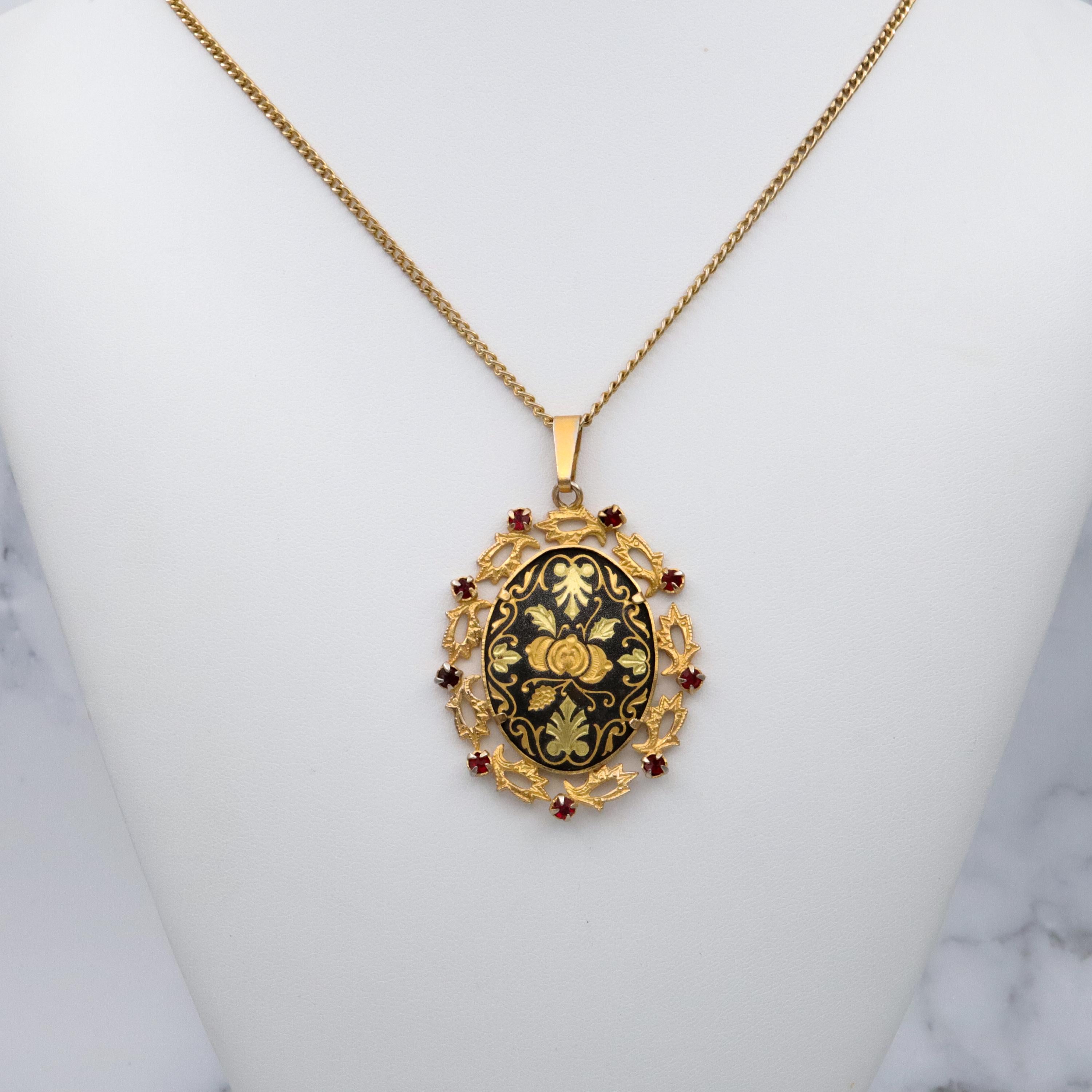 Mid Century Spanish damascene floral pendant with red rhinestone accents