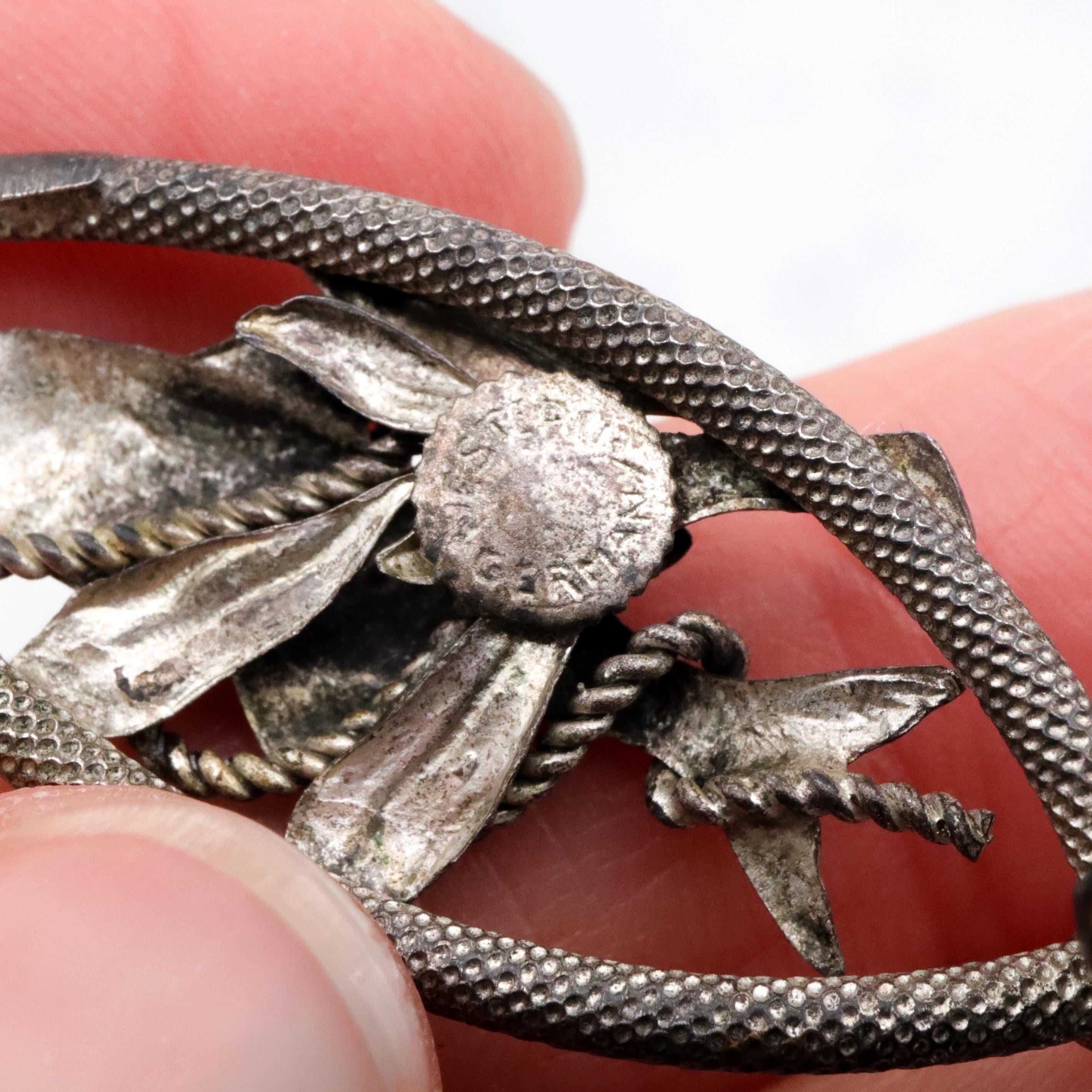 Vintage 1950s Western Germany "fish caught on a rope" silver plated brooch