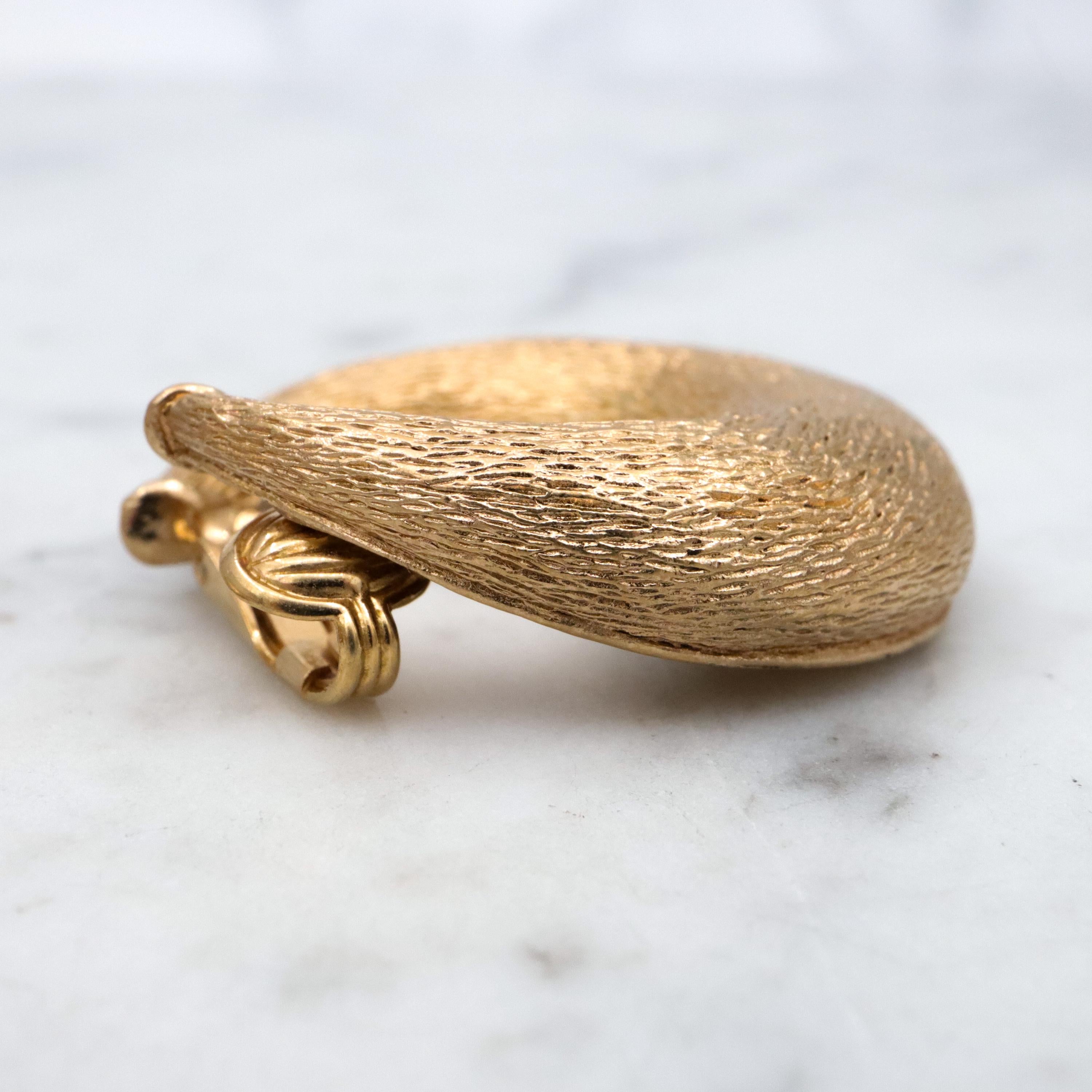 Vintage 70s Ciner textured gold plated flattened hoop huggie clip-on earrings