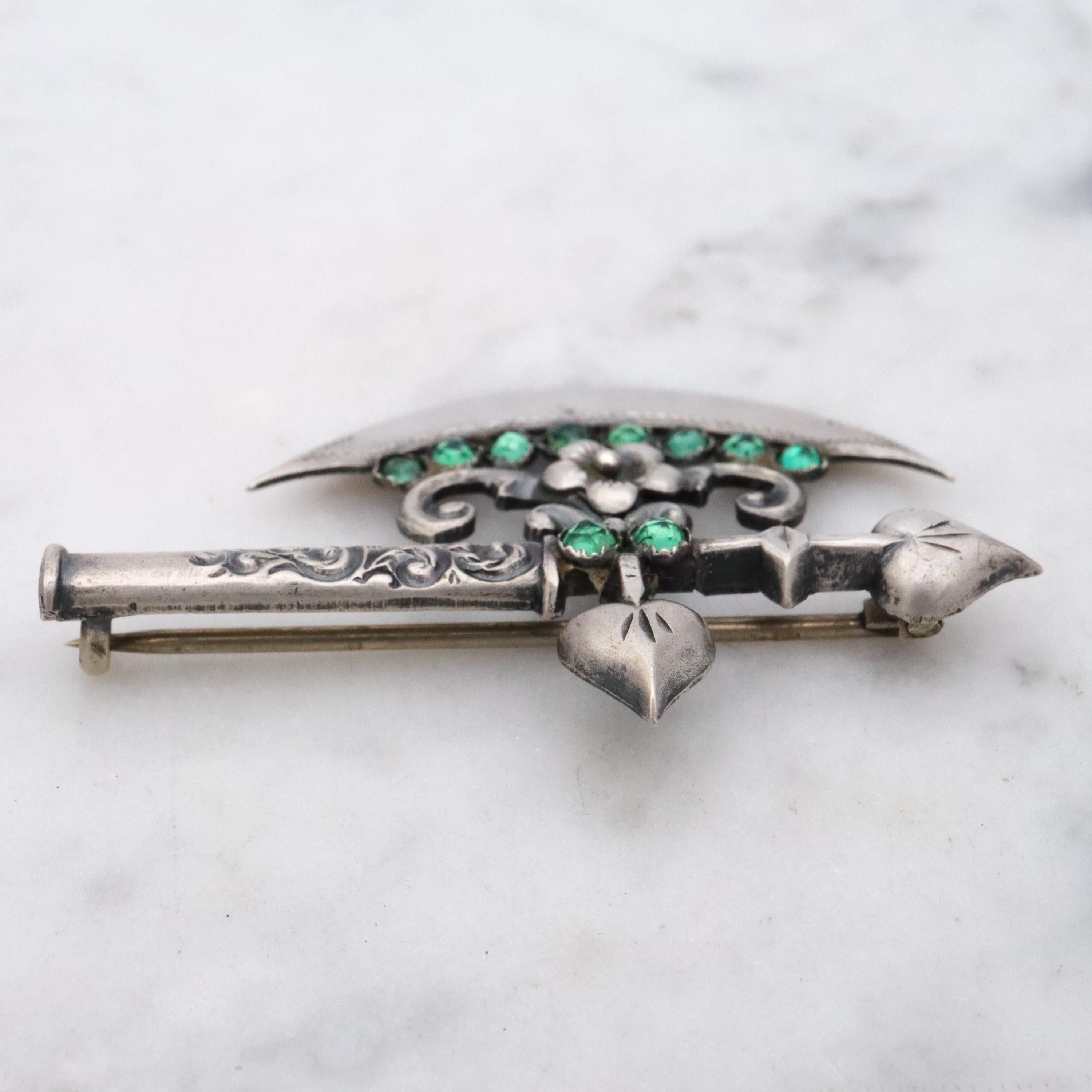 Rare Antique Victorian sterling fancy battle axe brooch with emerald paste gems
