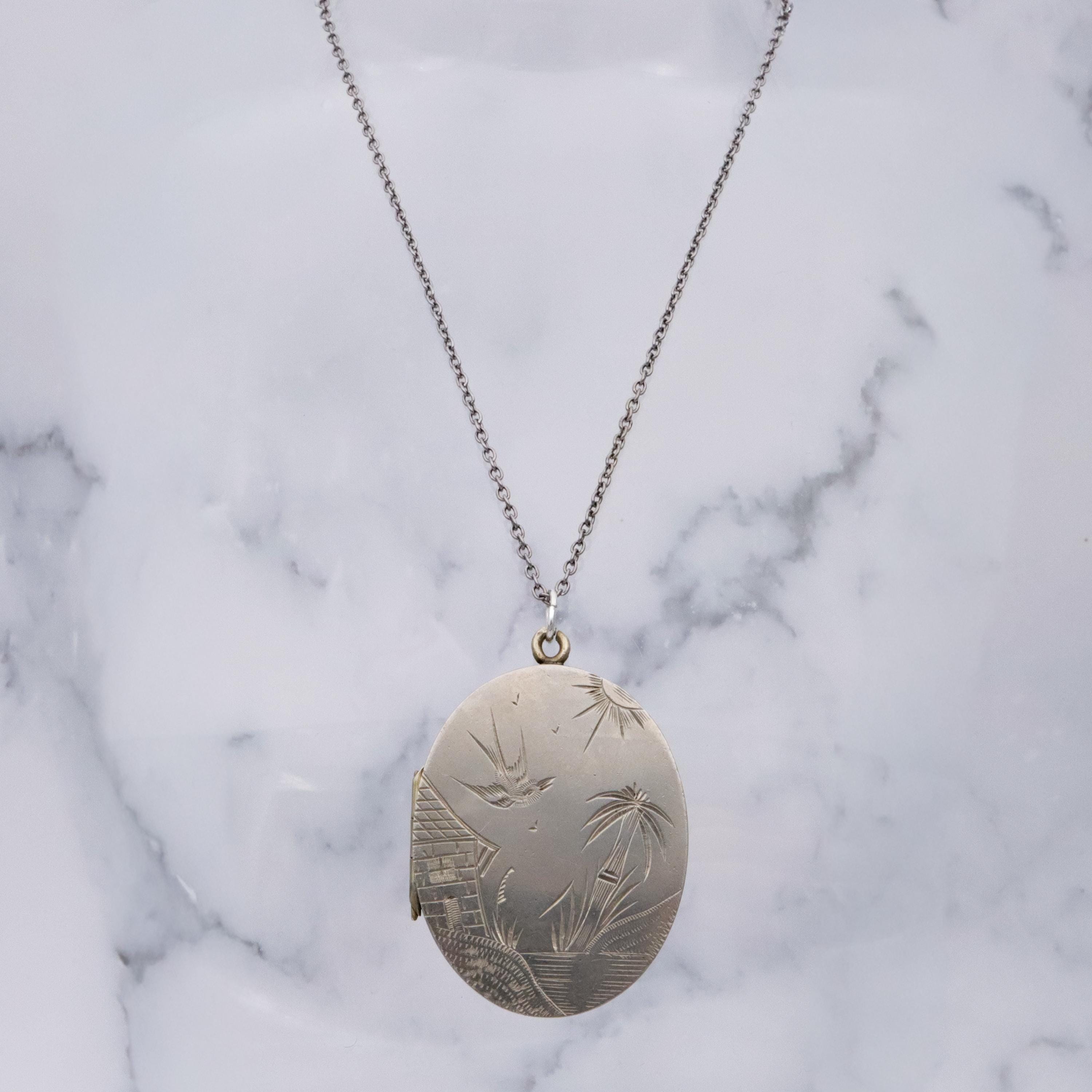 Victorian silver plated Aesthetic engraved swallow locket