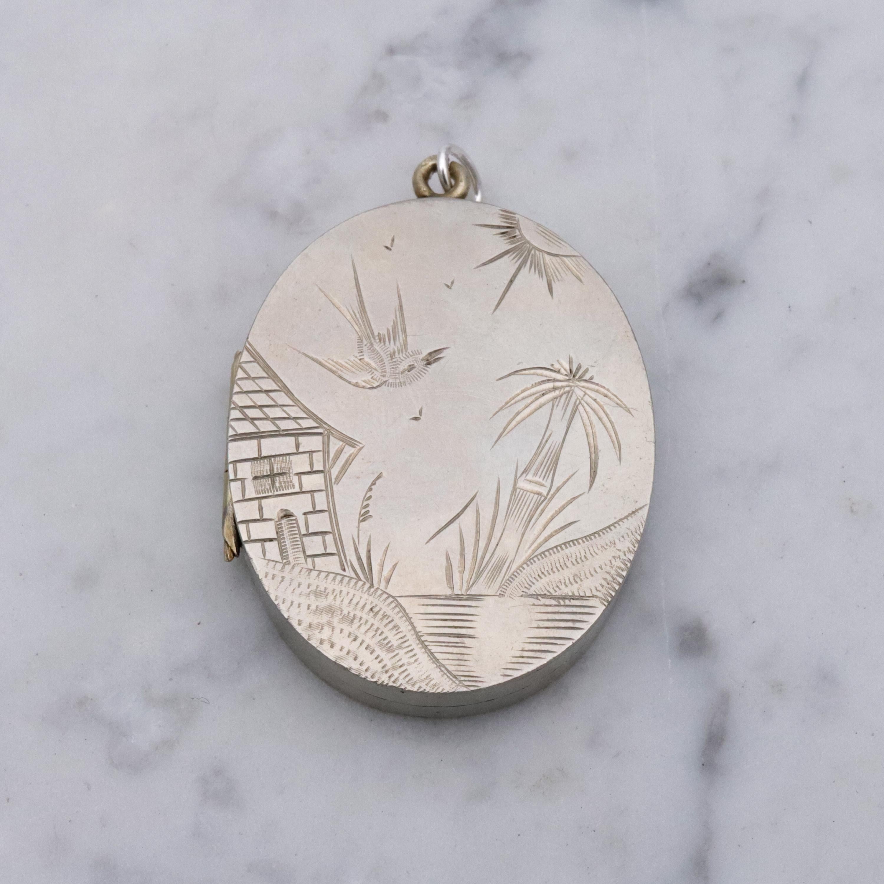 Victorian silver plated Aesthetic engraved swallow locket