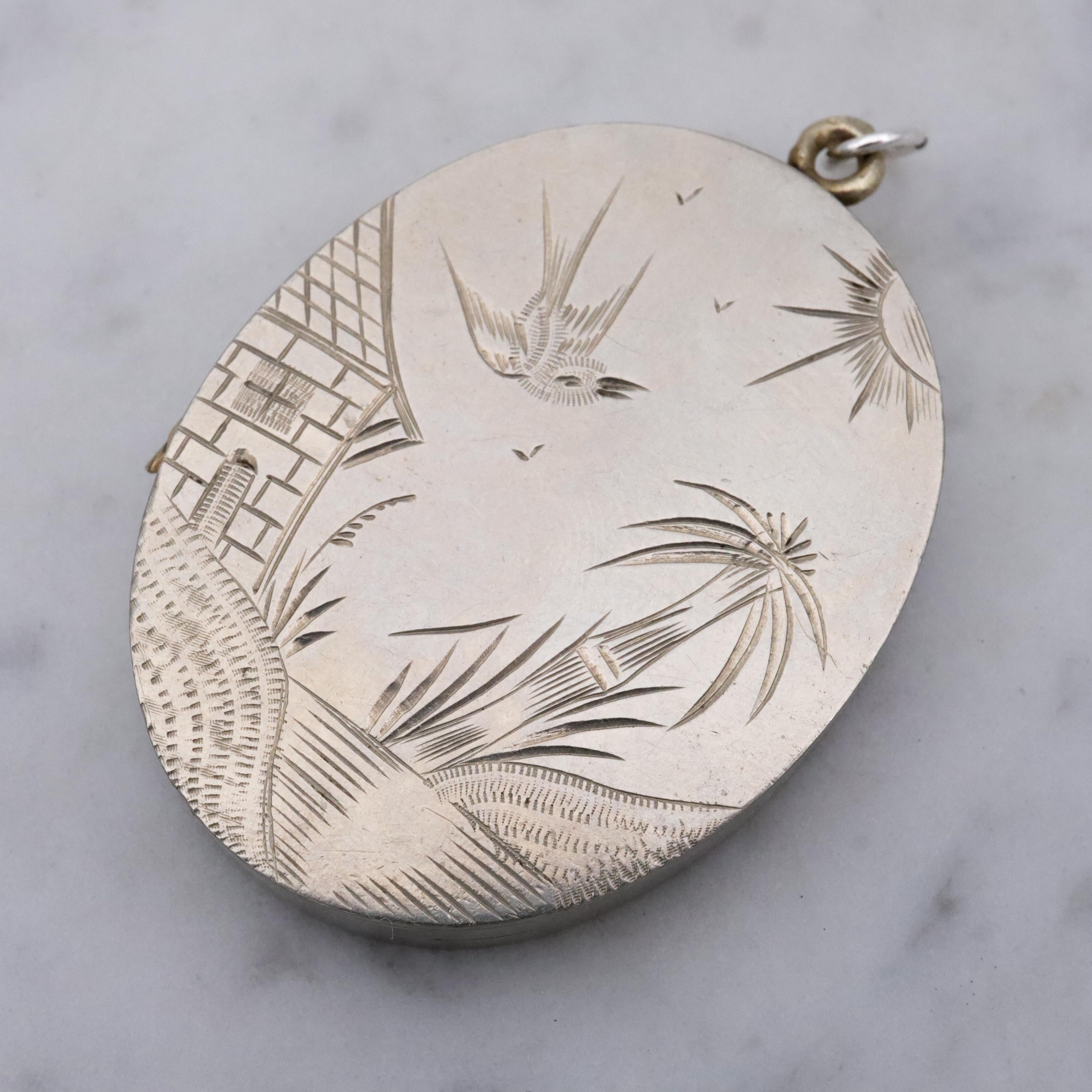 Victorian silver plated Aesthetic engraved swallow locket