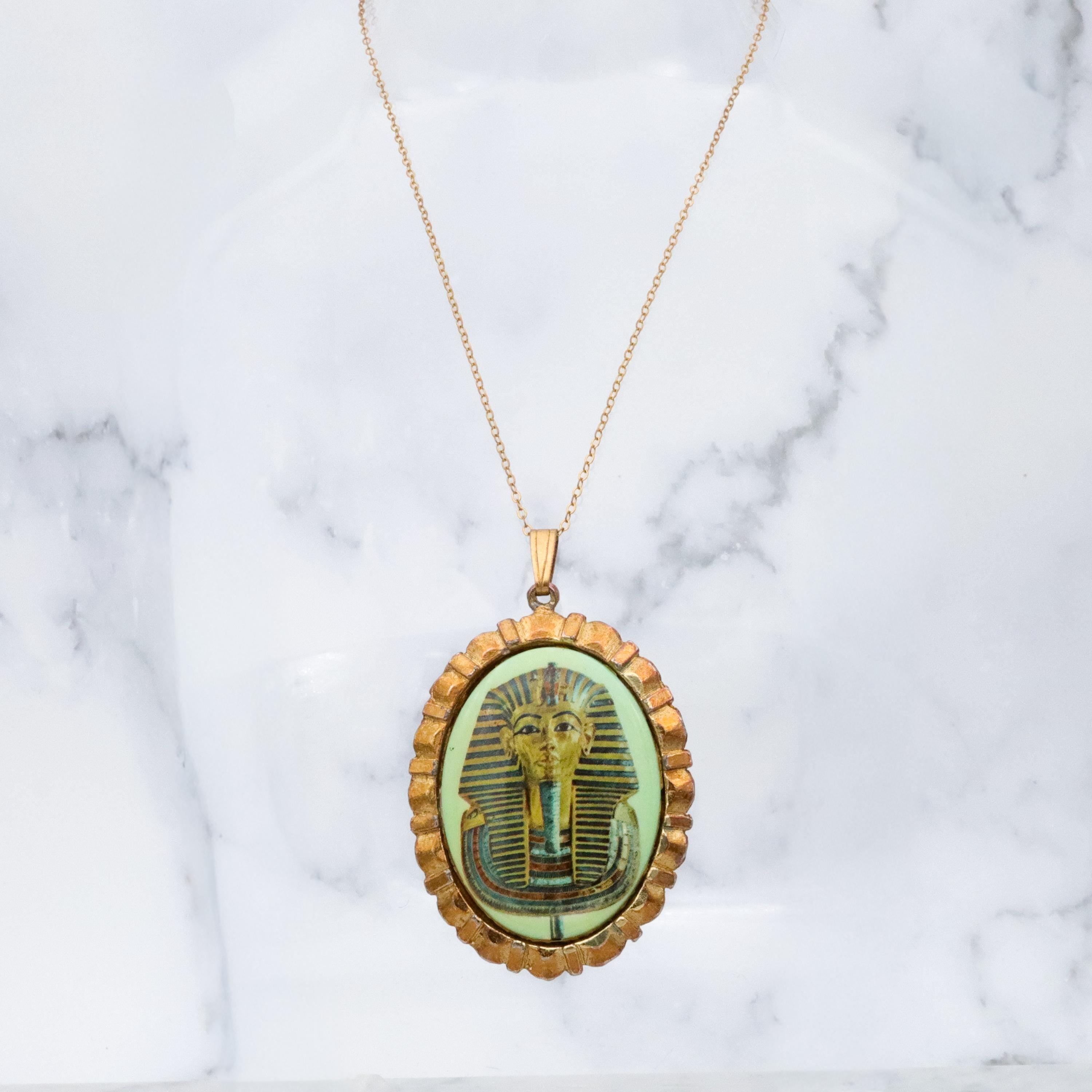 Mid Century gold tone & green glass Egyptian Revival plaque pendant