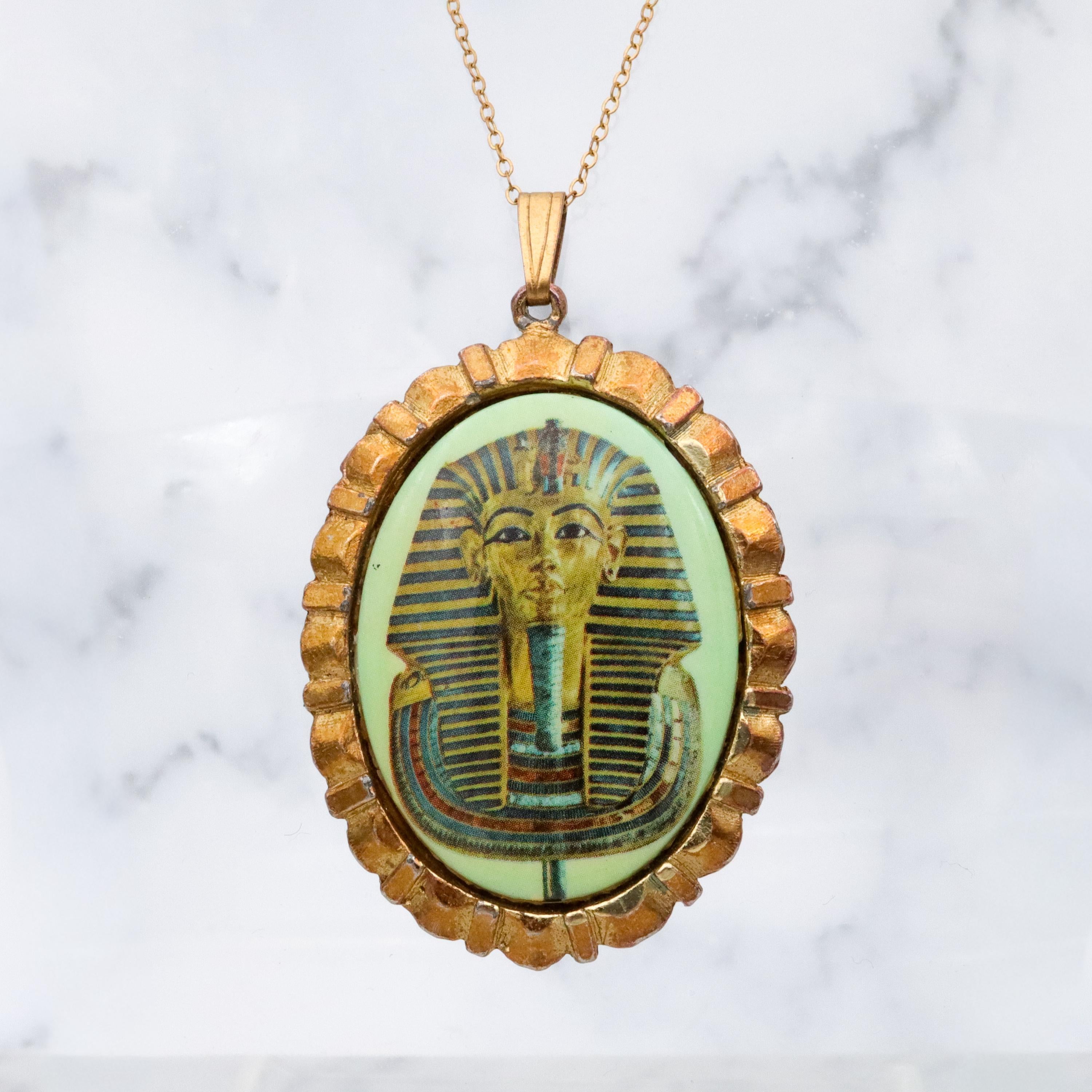 Mid Century gold tone & green glass Egyptian Revival plaque pendant