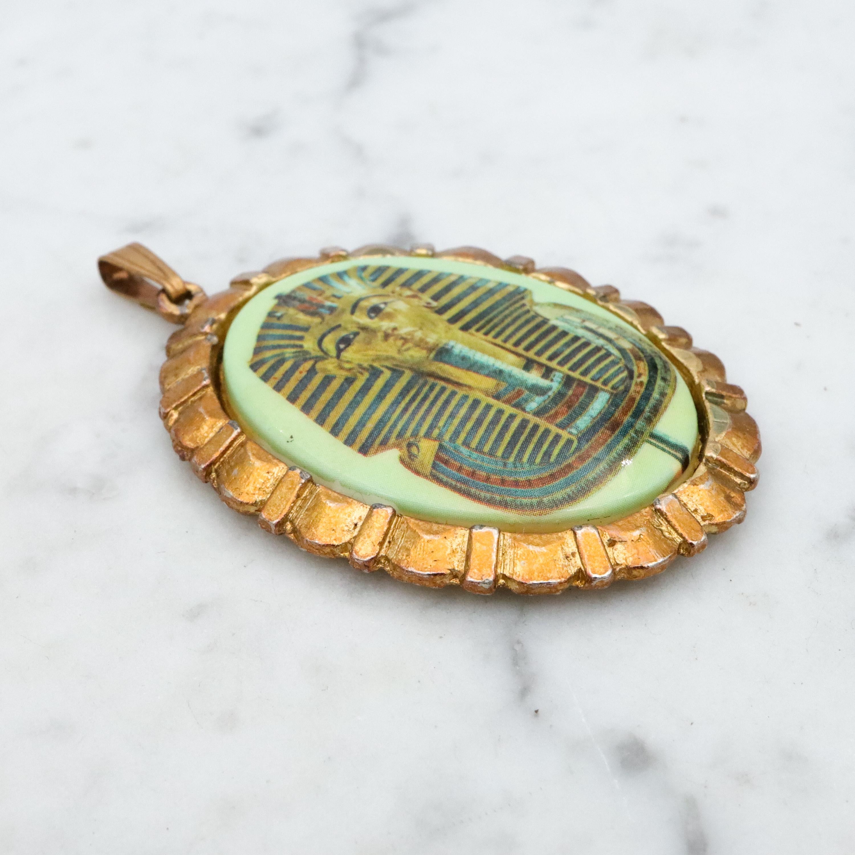 Mid Century gold tone & green glass Egyptian Revival plaque pendant