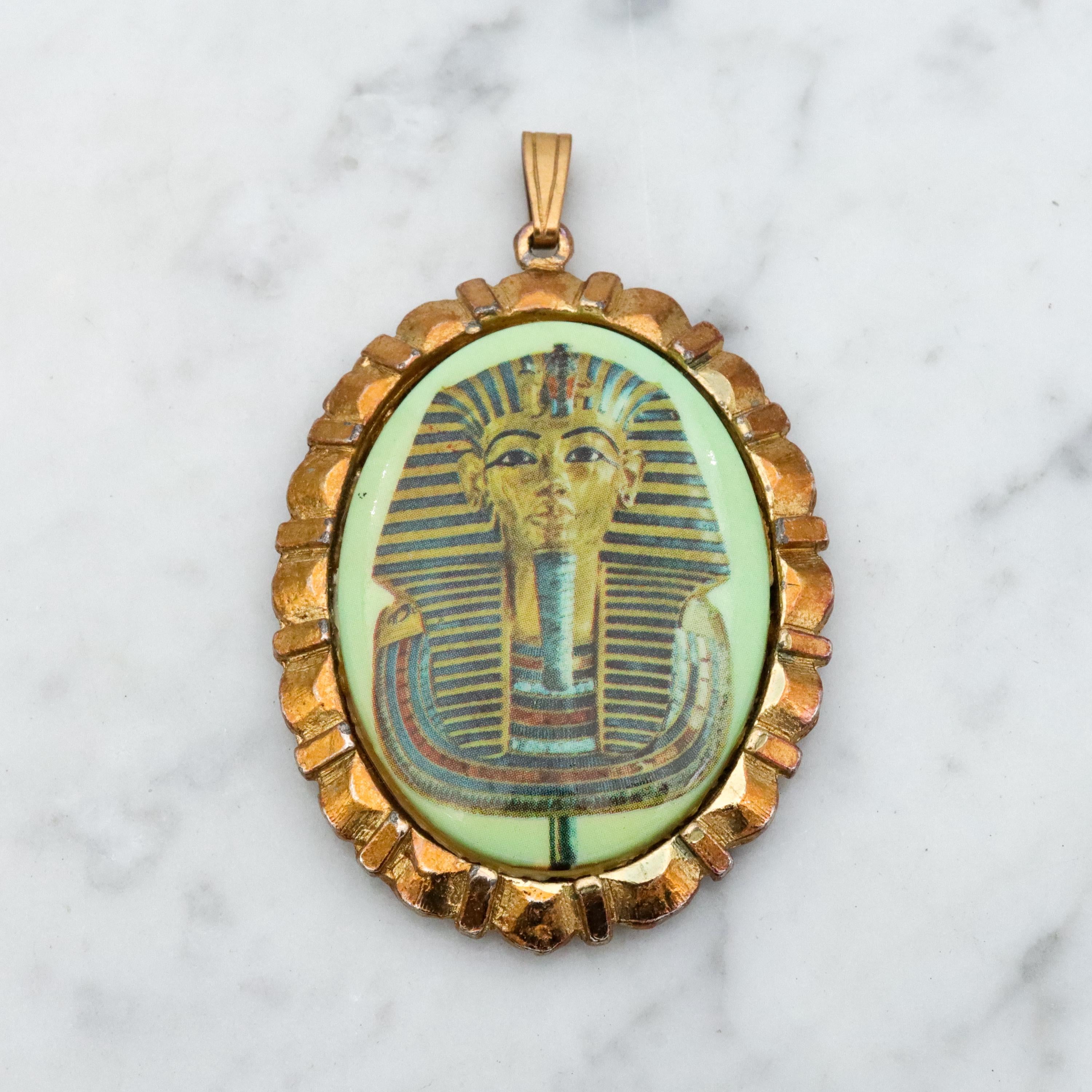 Mid Century gold tone & green glass Egyptian Revival plaque pendant