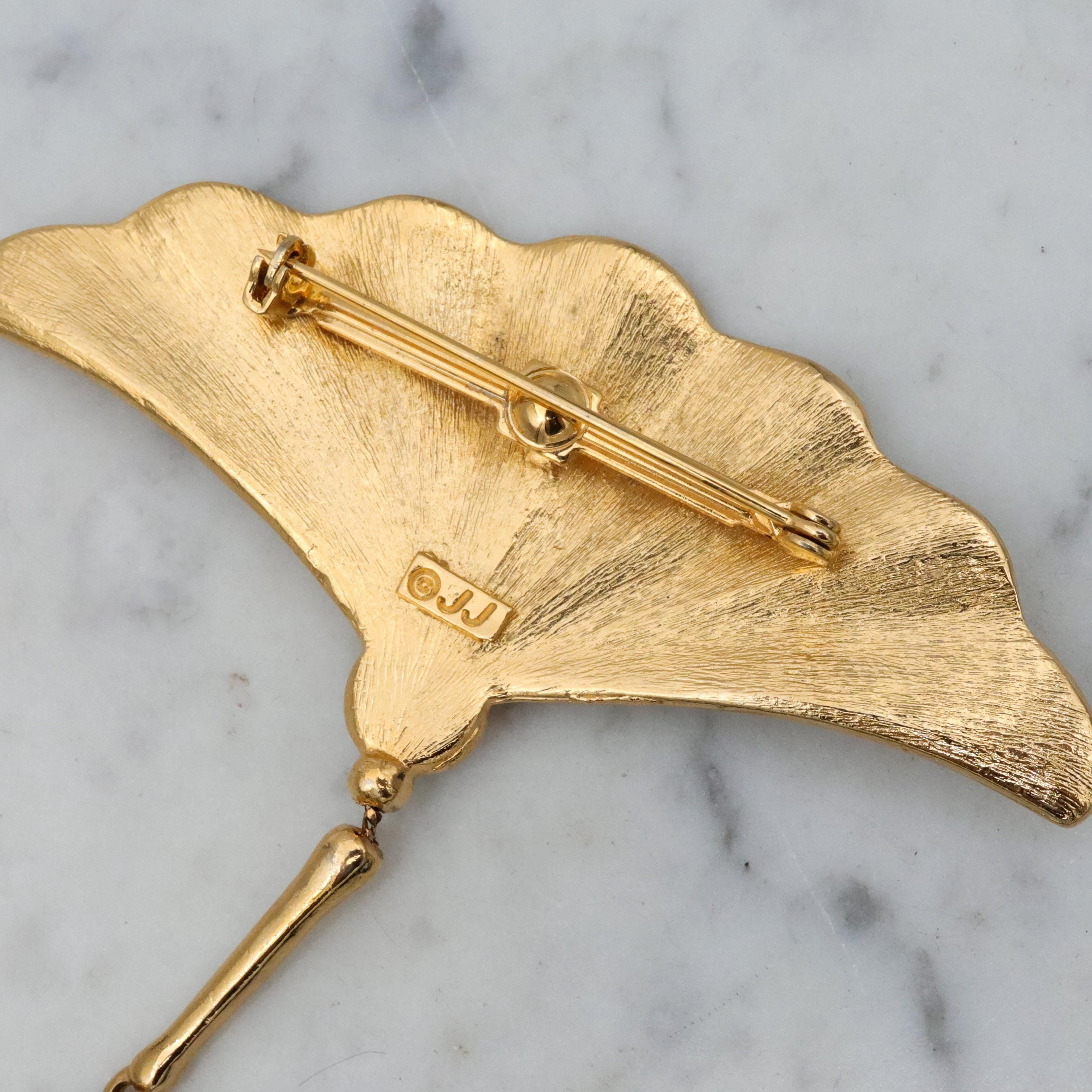 Vintage JJ Jonette gold tone fan brooch with drop