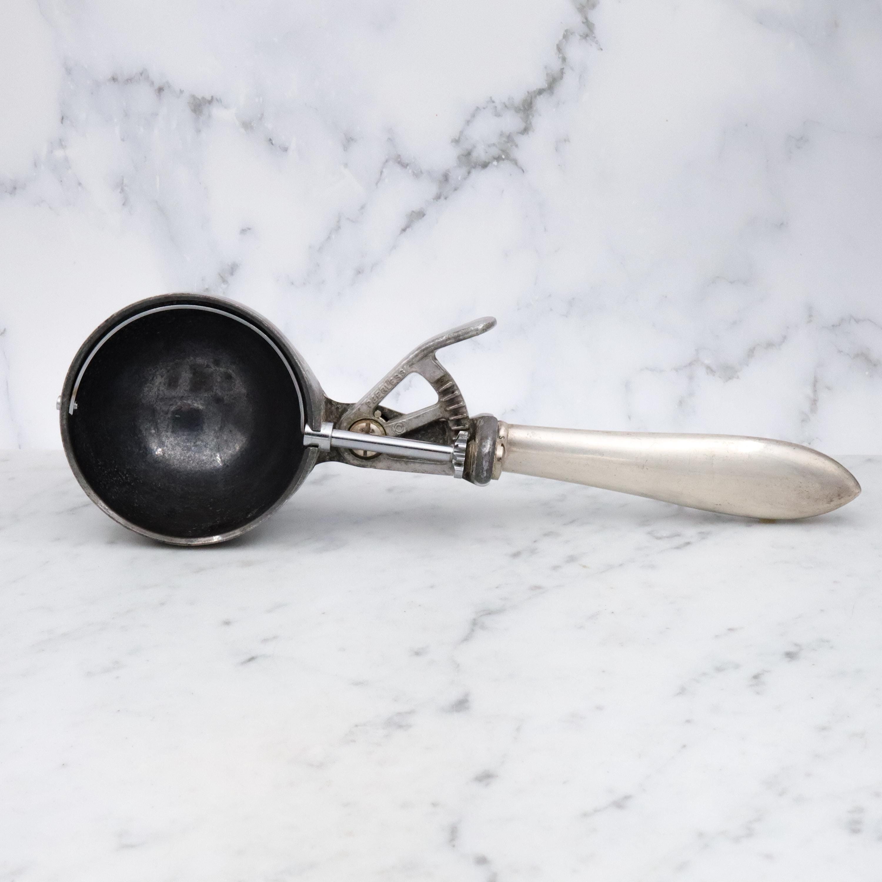 Retro Peerless aluminum spring loaded ice cream scoop with sterling handle