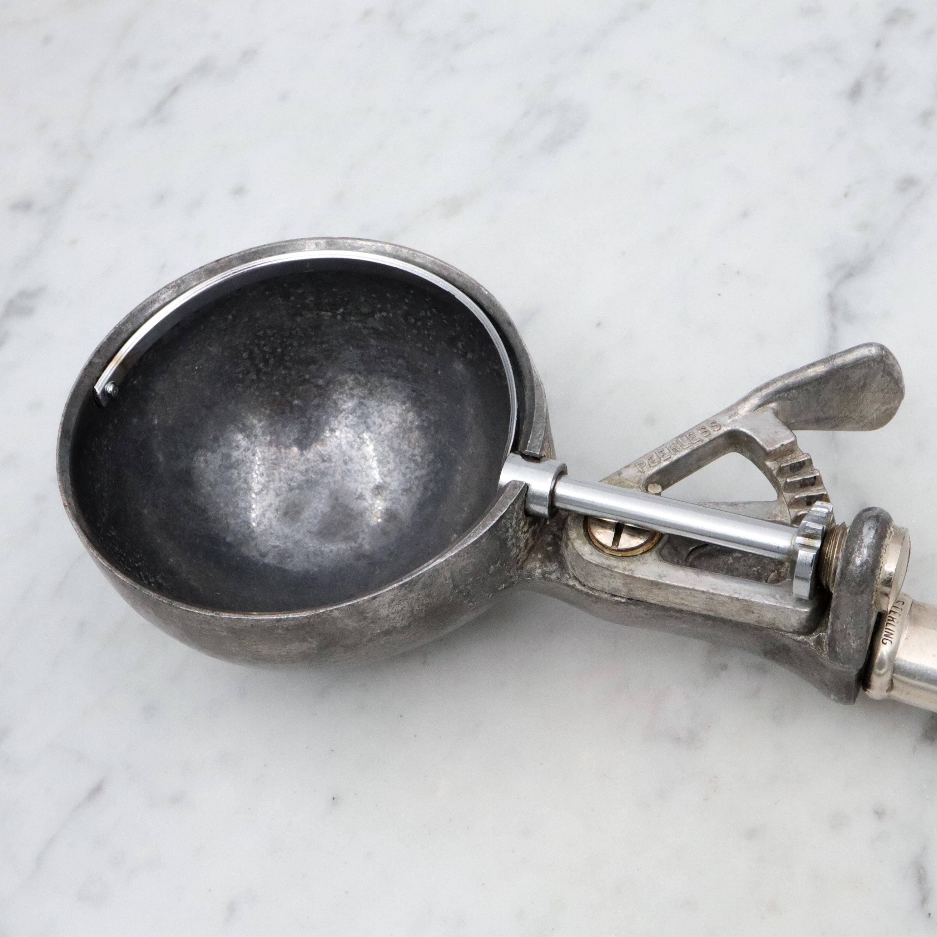 Retro Peerless aluminum spring loaded ice cream scoop with sterling handle