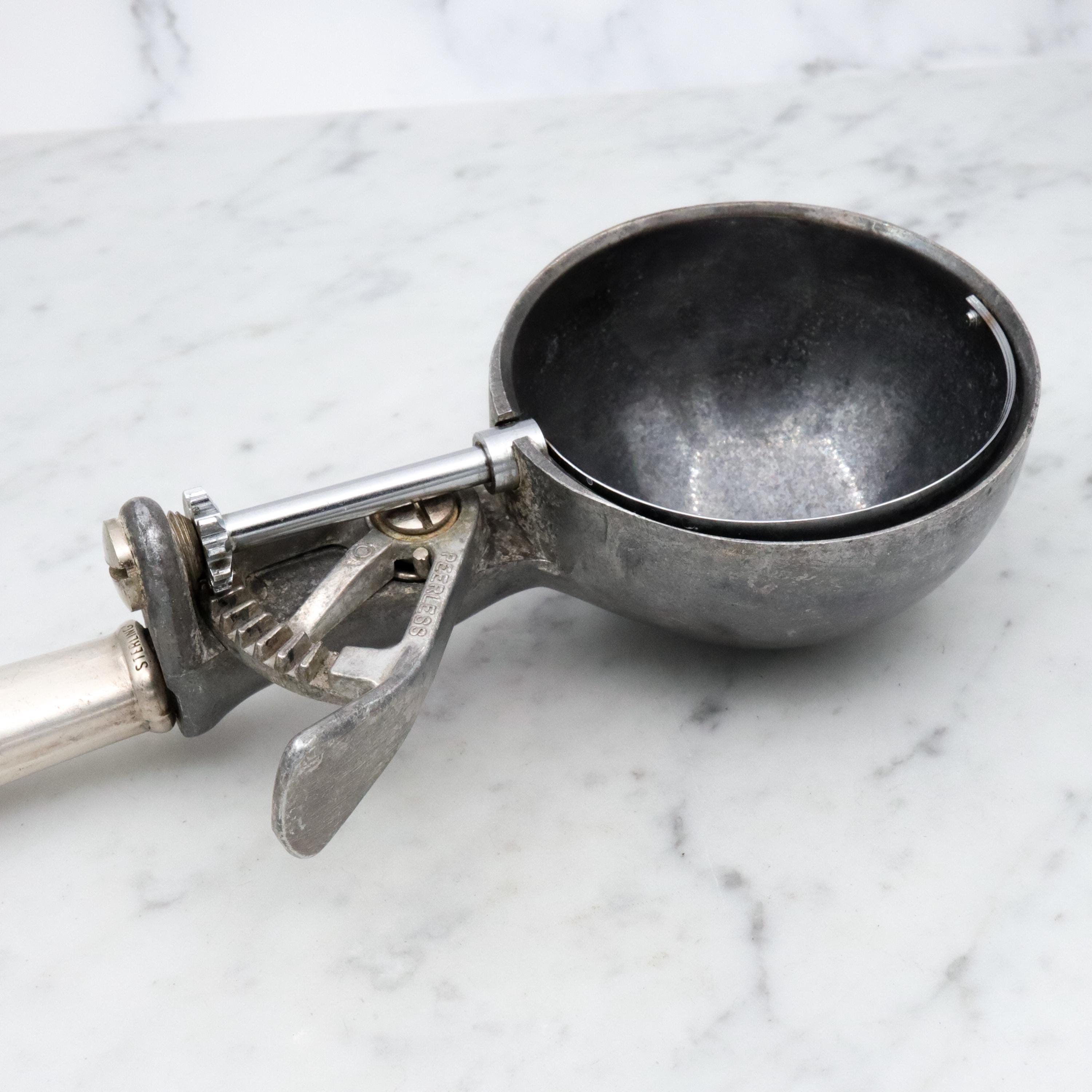 Retro Peerless aluminum spring loaded ice cream scoop with sterling handle