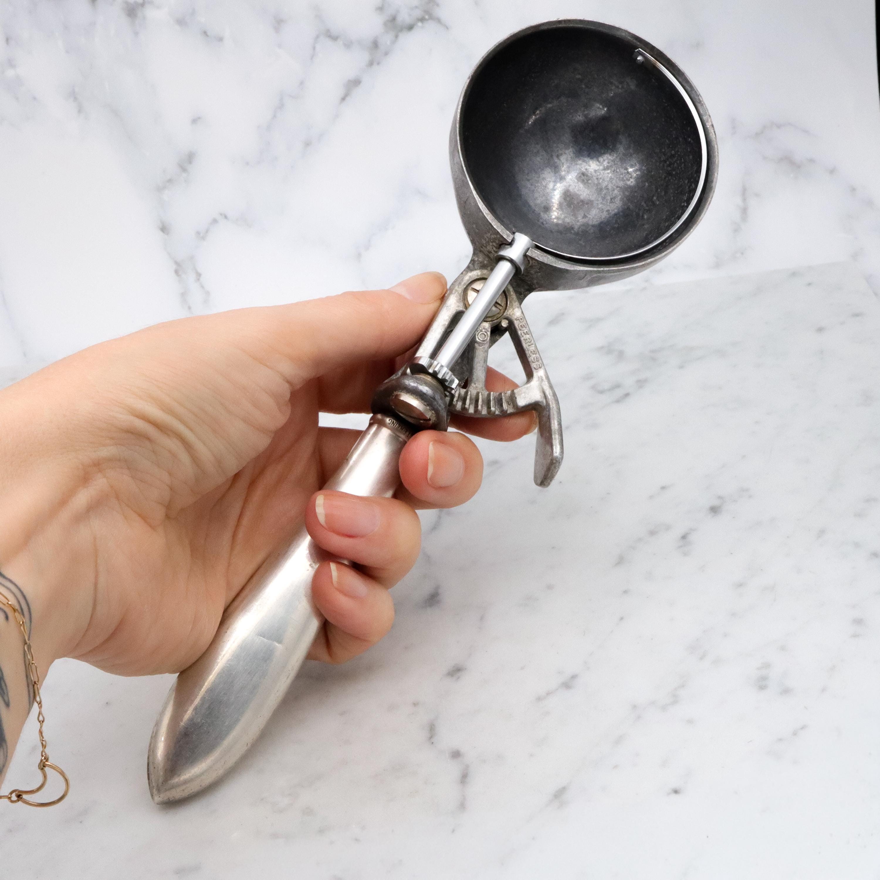 Retro Peerless aluminum spring loaded ice cream scoop with sterling handle